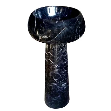 A black marble vessel with a wide, rounded top and a cylindrical base.