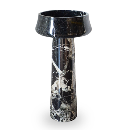 Marble side table with a circular top and cylindrical base.