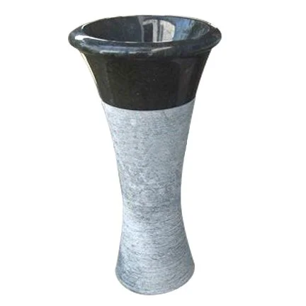 A tall, decorative vase with a black top and a light gray, textured lower section.