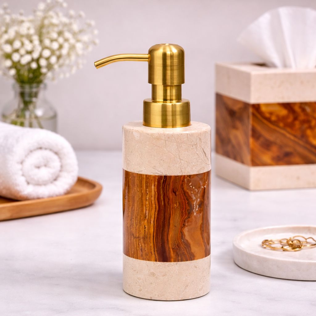 A soap dispenser with a marble and wood design, placed on a white surface, with a box of tissues, a tray with jewelry, and a bouquet of white flowers in the background.