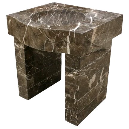 Brown marble fireplace with a curved top and a rectangular base, featuring white veining throughout.