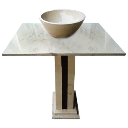 A marble table with a bowl placed on top.
