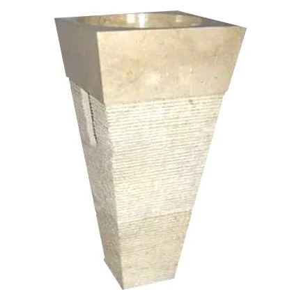 A concrete fountain or architectural structure with a square top and a tapered rectangular shape.