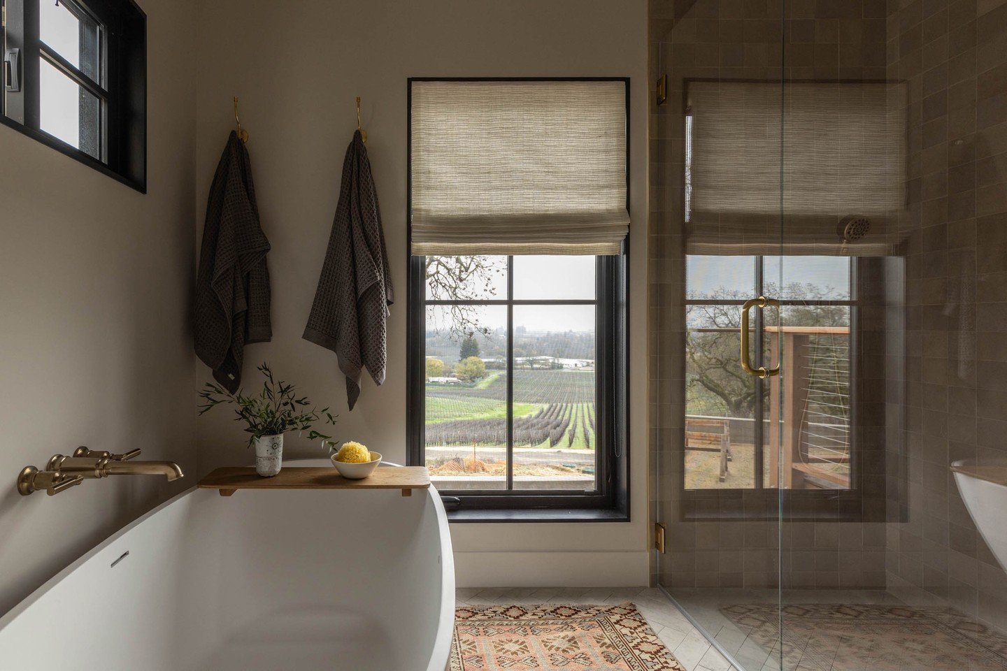 A sanctuary of tranquility. Neutral tones, luxurious textures, and sweeping vineyard views make this primary bathroom a peaceful retreat. Every detail was thoughtfully chosen to create an atmosphere of calm and understated luxury.

For those who crav