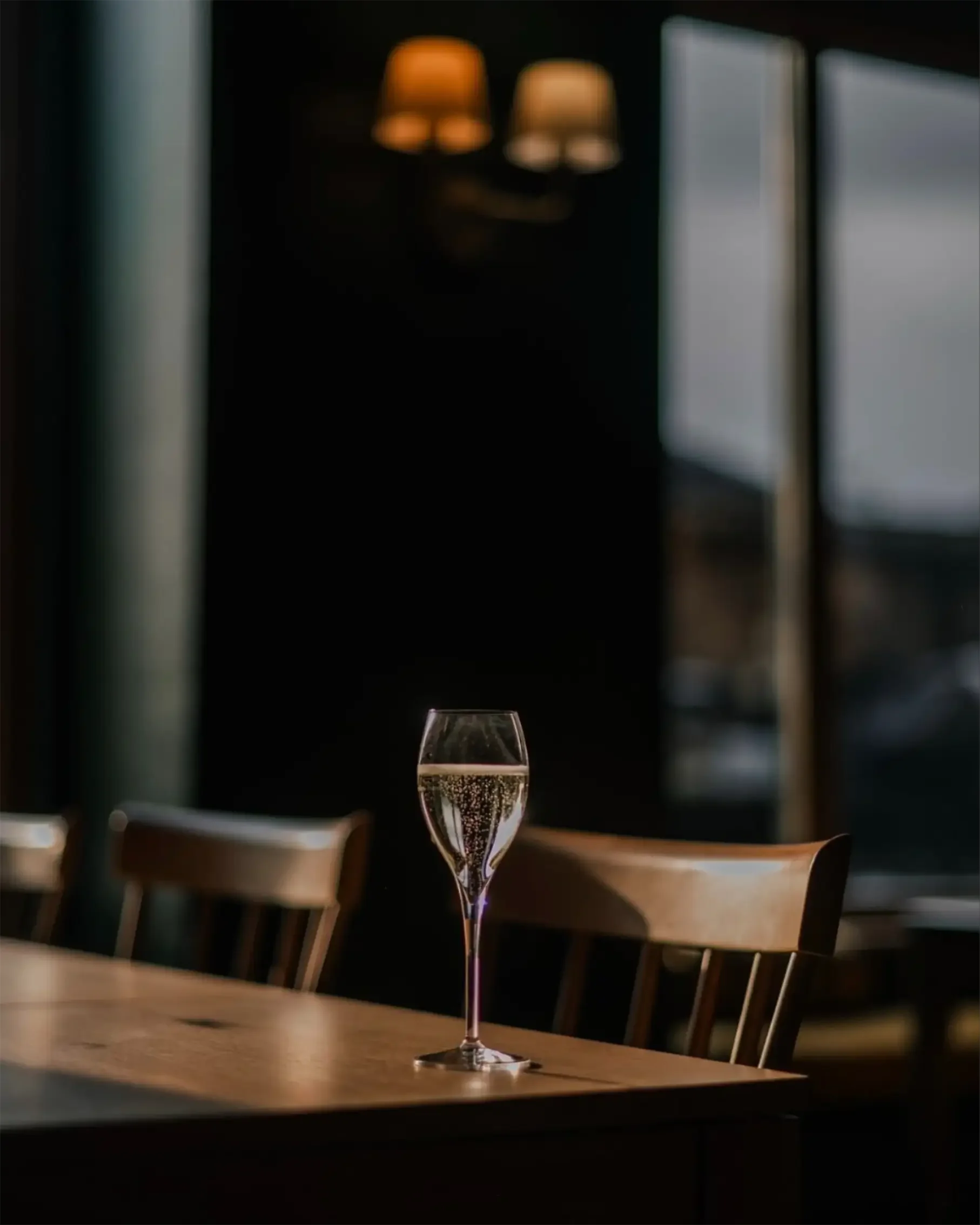 Interior shot of the Captian Darling Edinburgh with champagne flute.