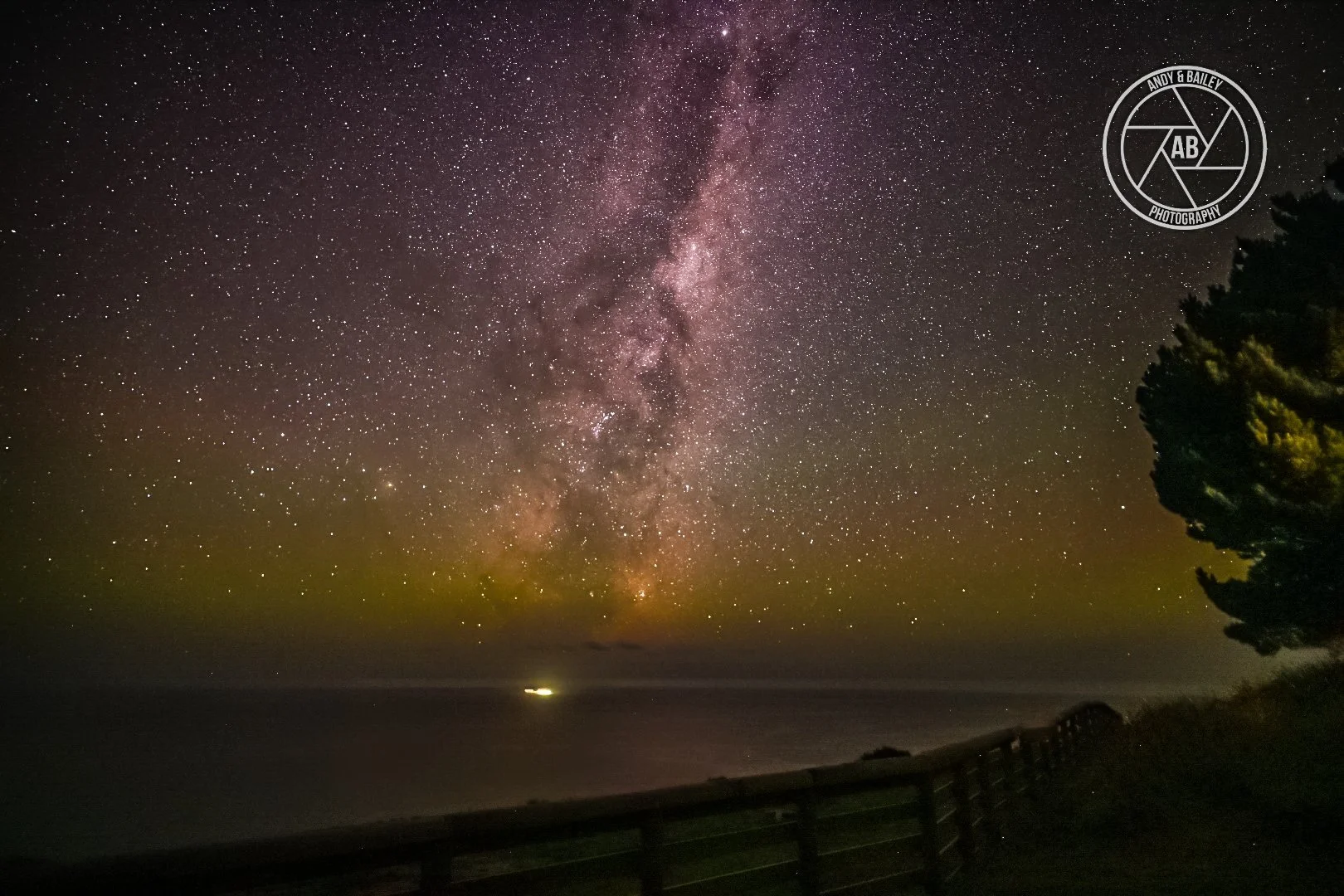 Night time view of a starry sky over the ocean, seen from The Last Resort walk in Tora, Wairarapa.