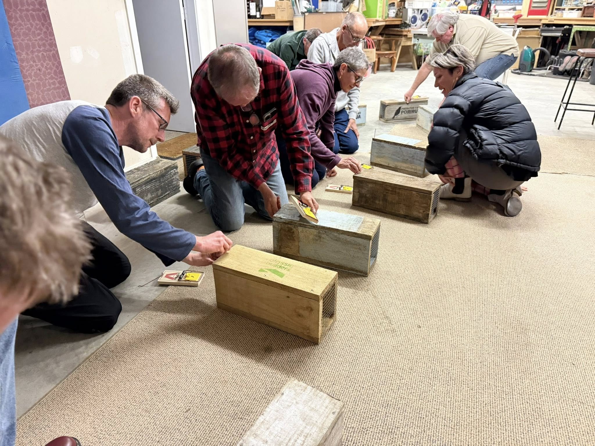 A group of people learning how to use traps safely and effectively