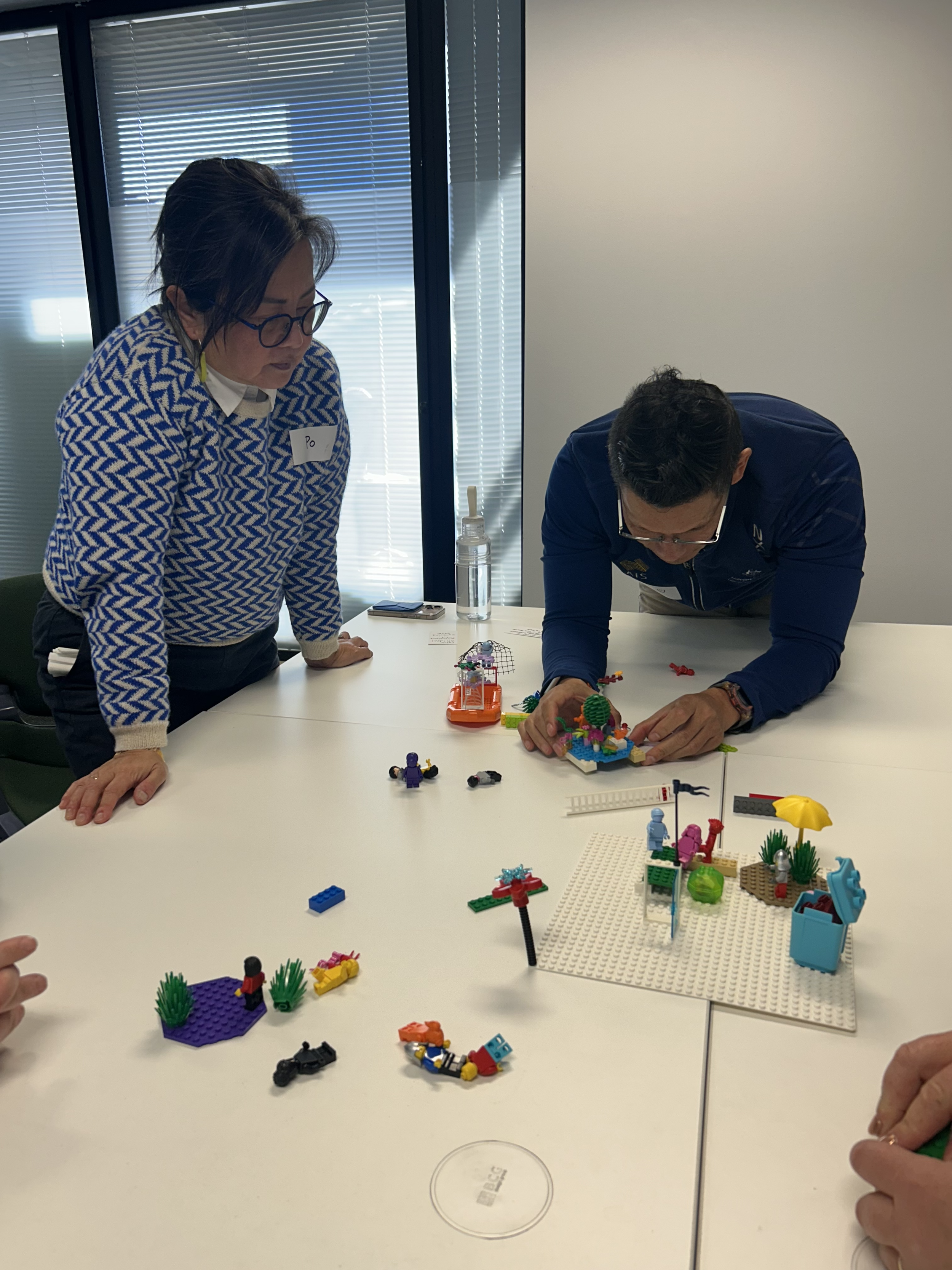 Individual Lego bricks symmetrically aligned on a desk