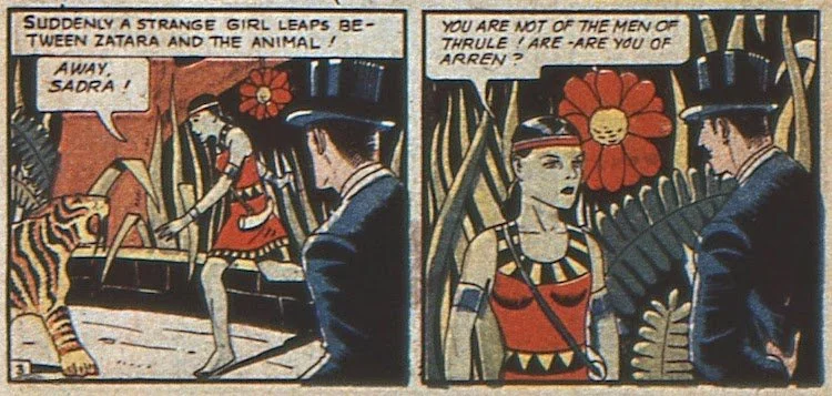 A green-skinned girl in a vaguely "tribal" outfit shoos away a saber-toothed tiger and asks Zatara who he is.
