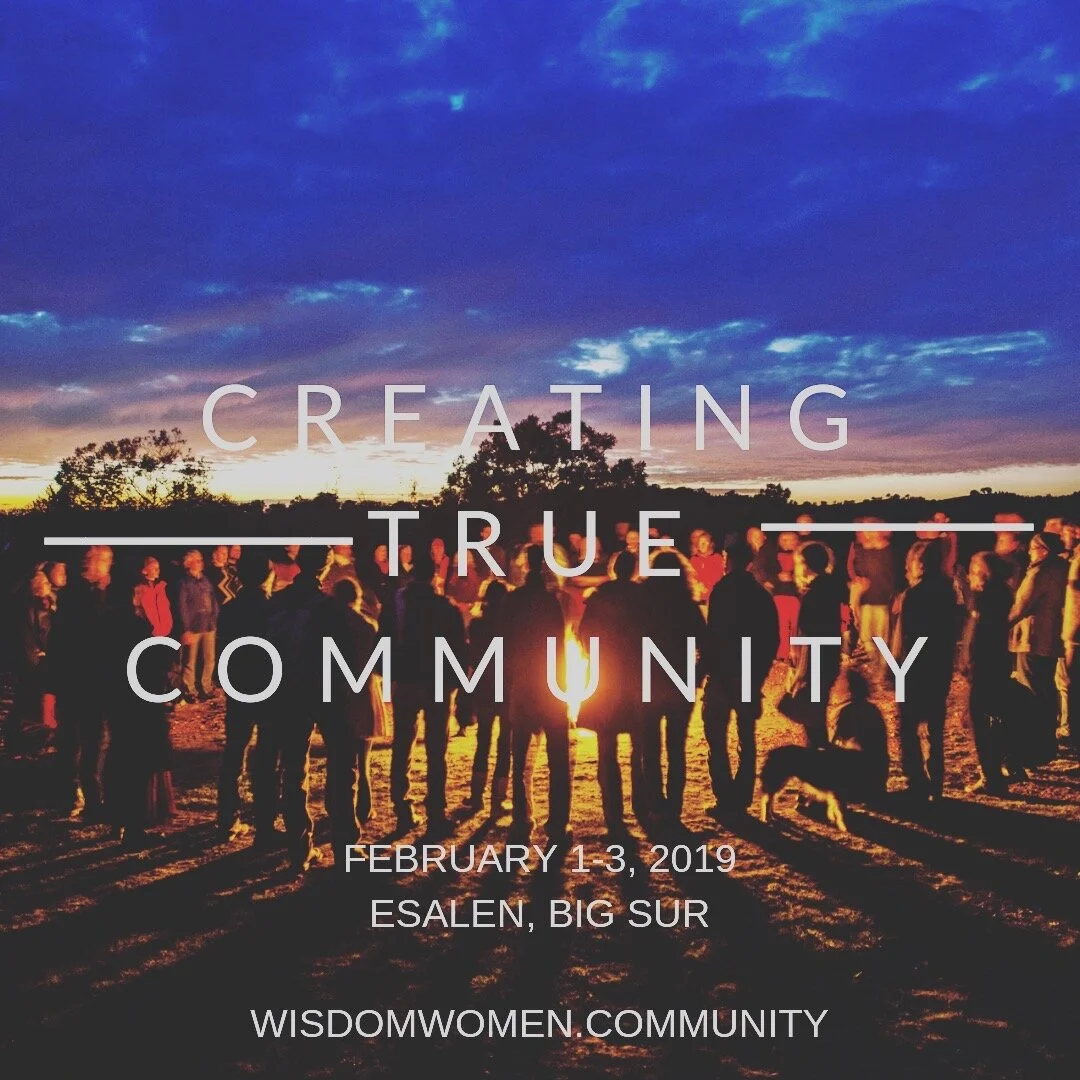 A group of people gathered outdoors at sunset or dusk, with the sky showing shades of blue, purple, and orange. The silhouettes of trees and people are visible, and there is some text overlay promoting the event "Creating True Community" happening fr