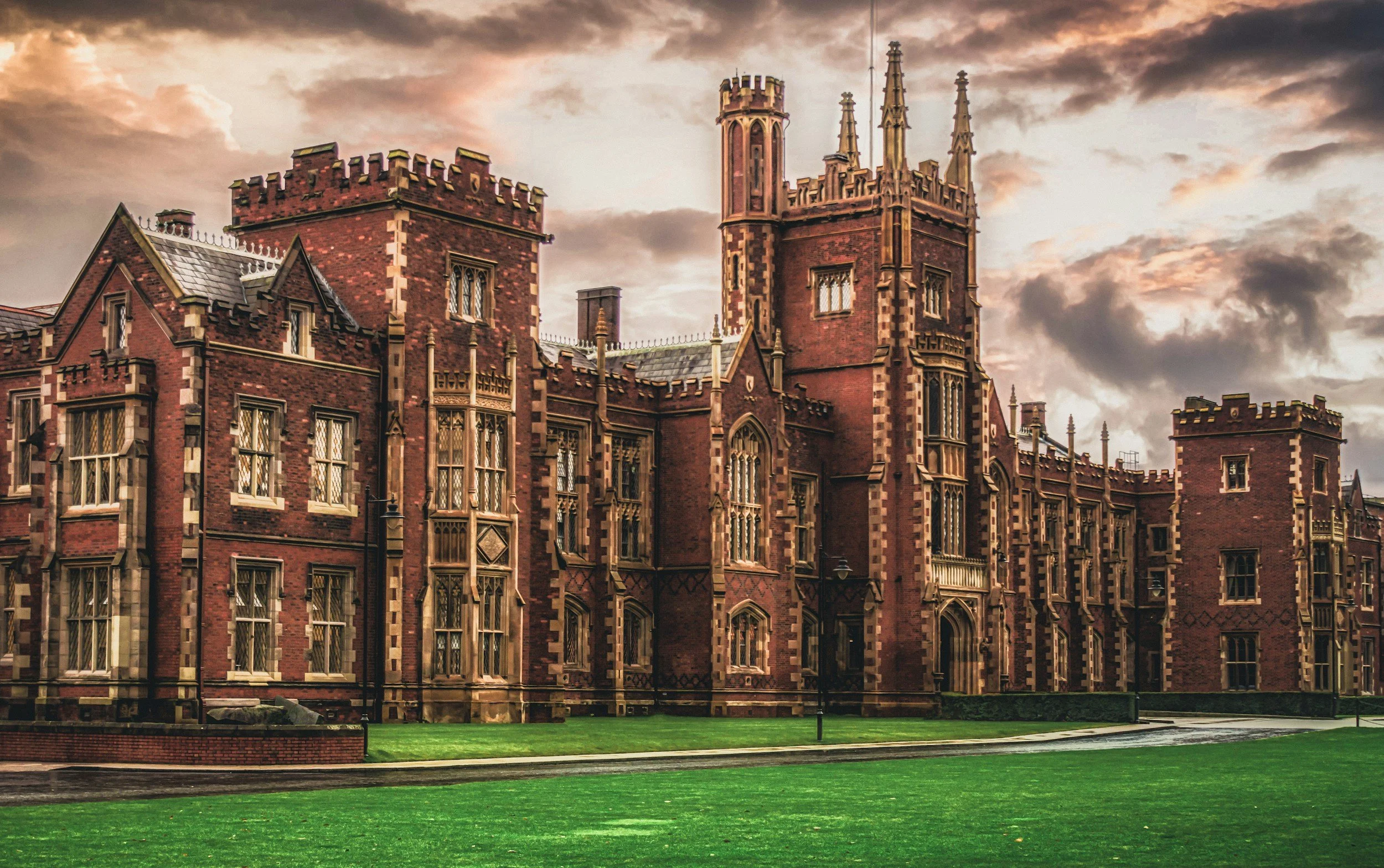 Northrn Ireland university building of red bricks with tall towers and detailed windows