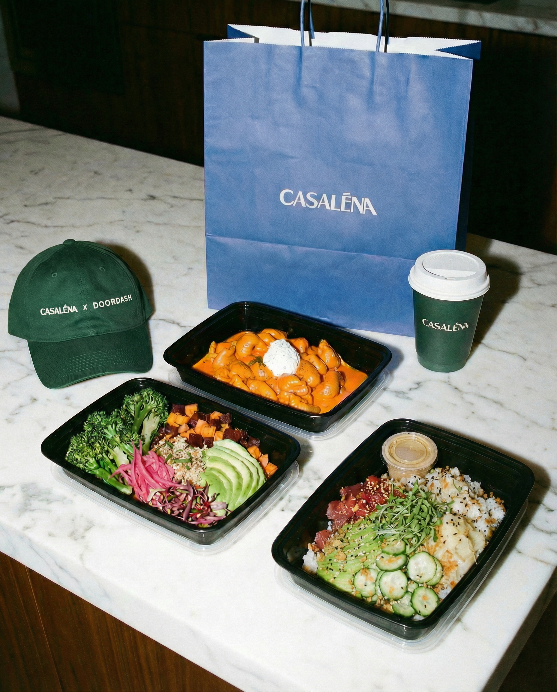 Casaléna's menu items displayed in takeaway containers.