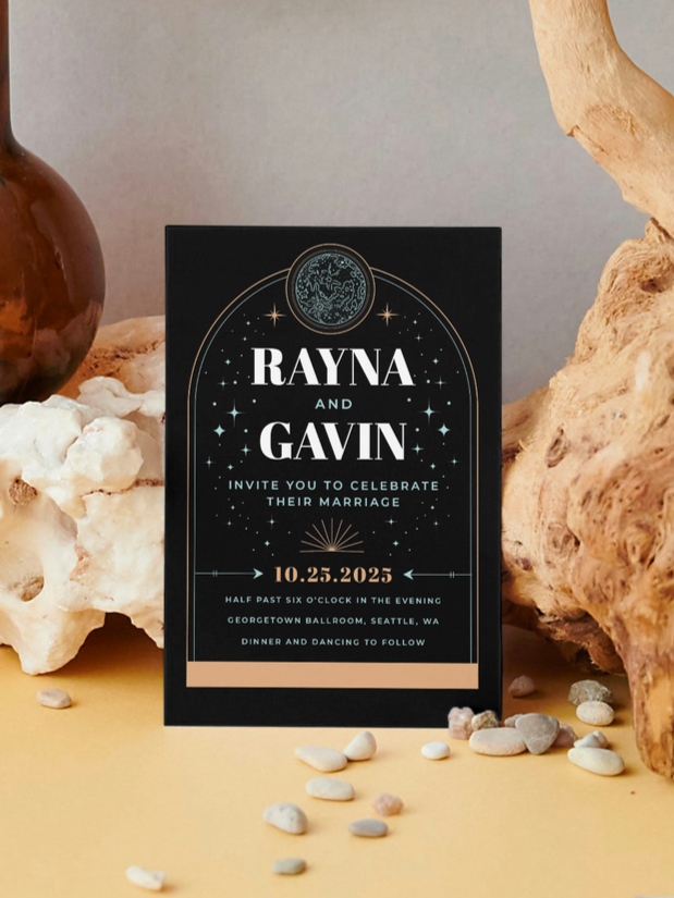 Wedding invitation card with celestial design, titled with the names Rayna and Gavin, details of the wedding date, time, location, and celebration activities.