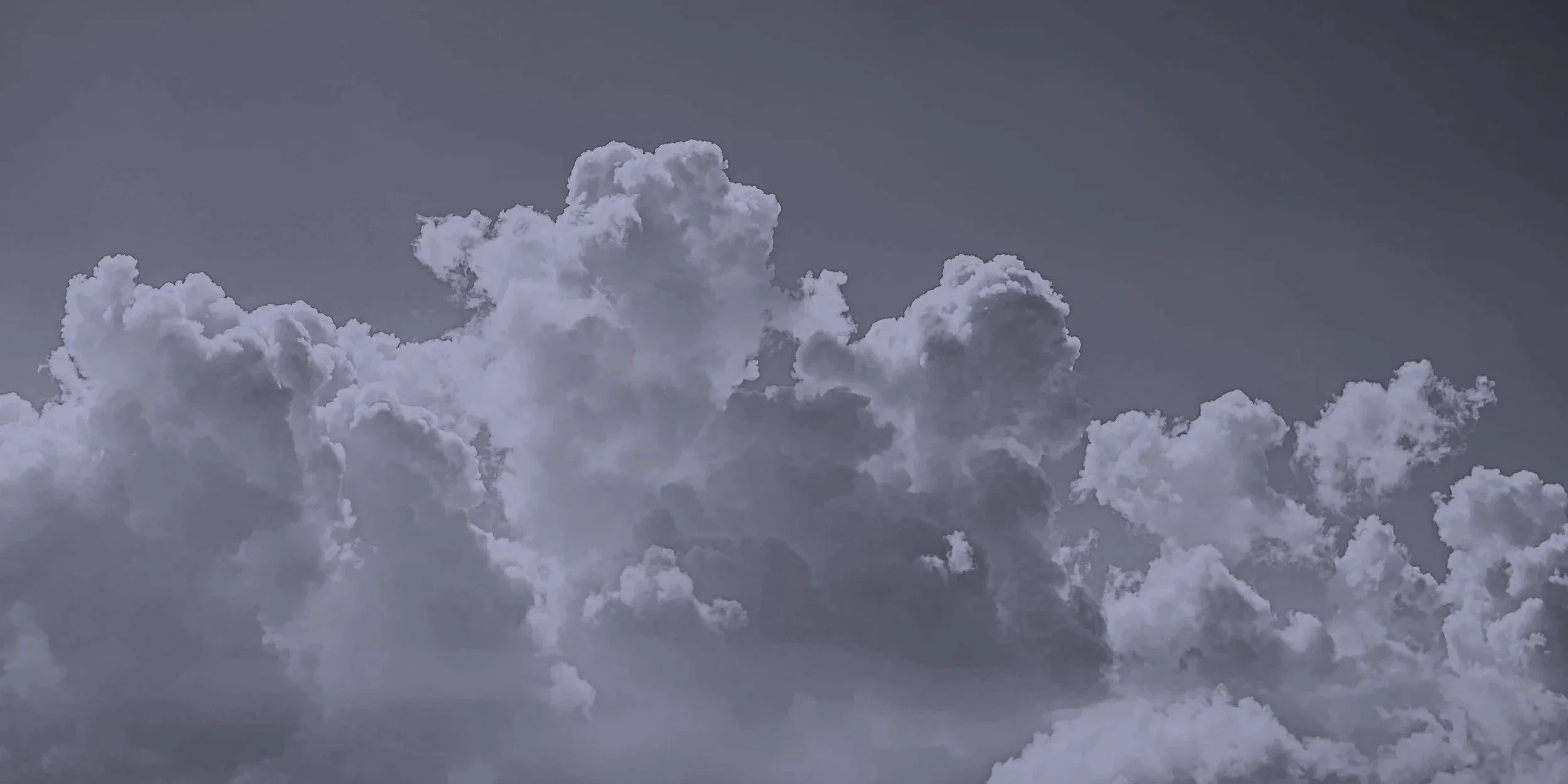 Grey clouds covering the sky in an overcast appearance.