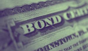 Close-up of a newspaper headline about bonds.