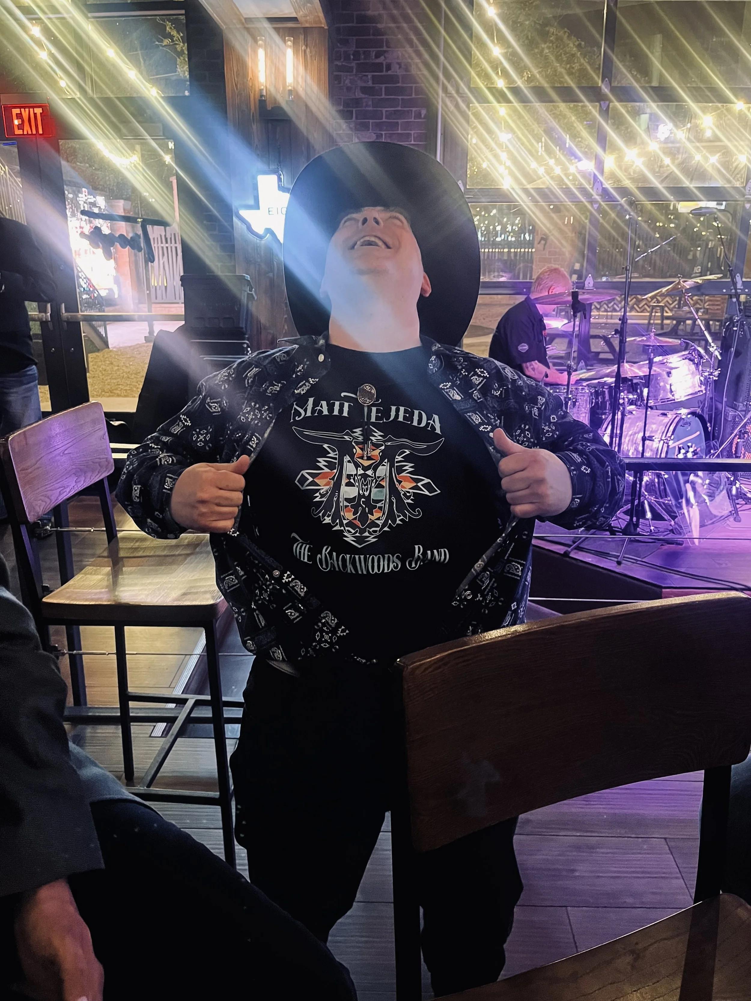 Sterling Radio sporting his Matt Tejeda and The Backwoods Band merch.