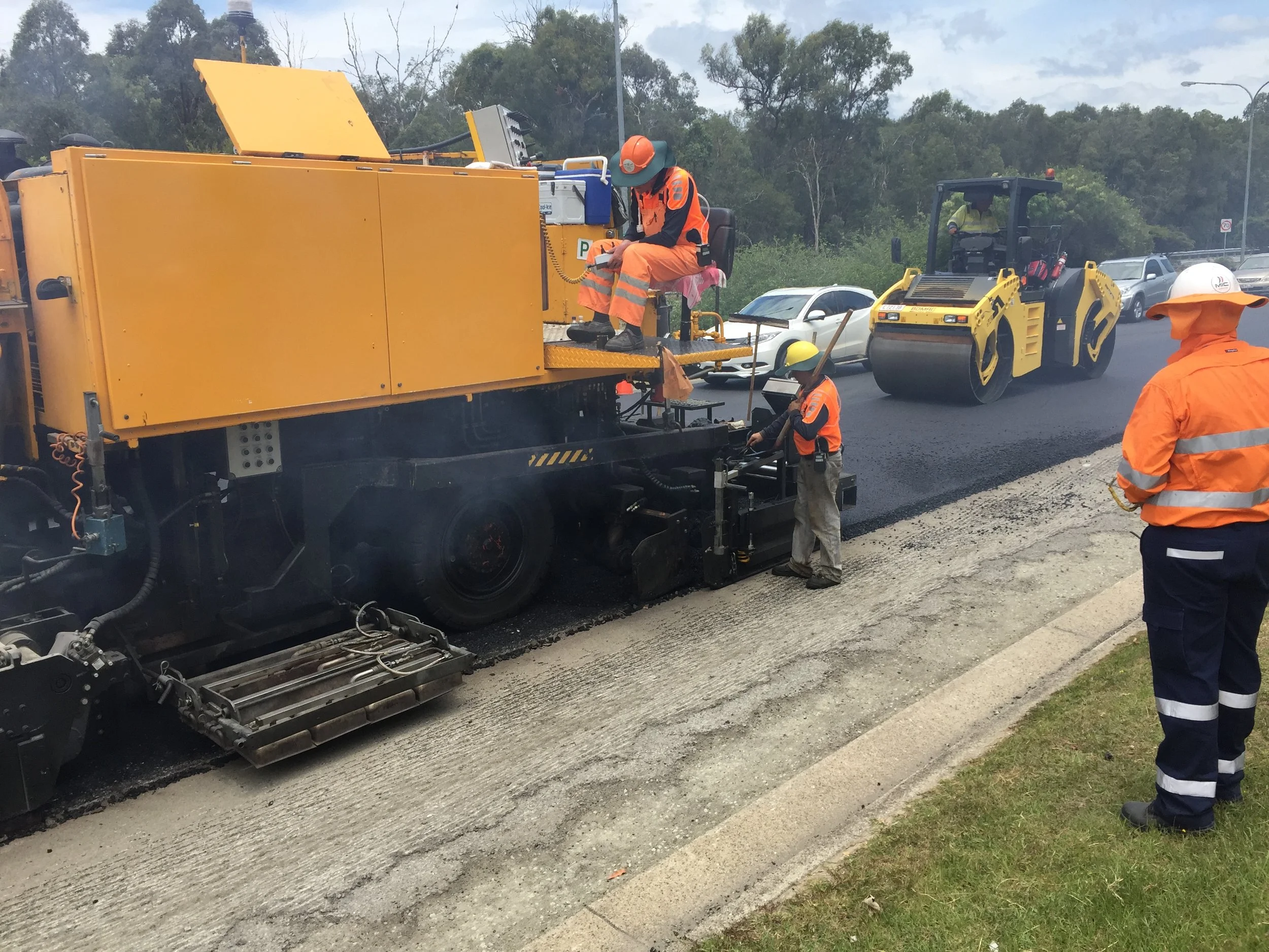 State government road resurfacing project laying new asphalt by TMR