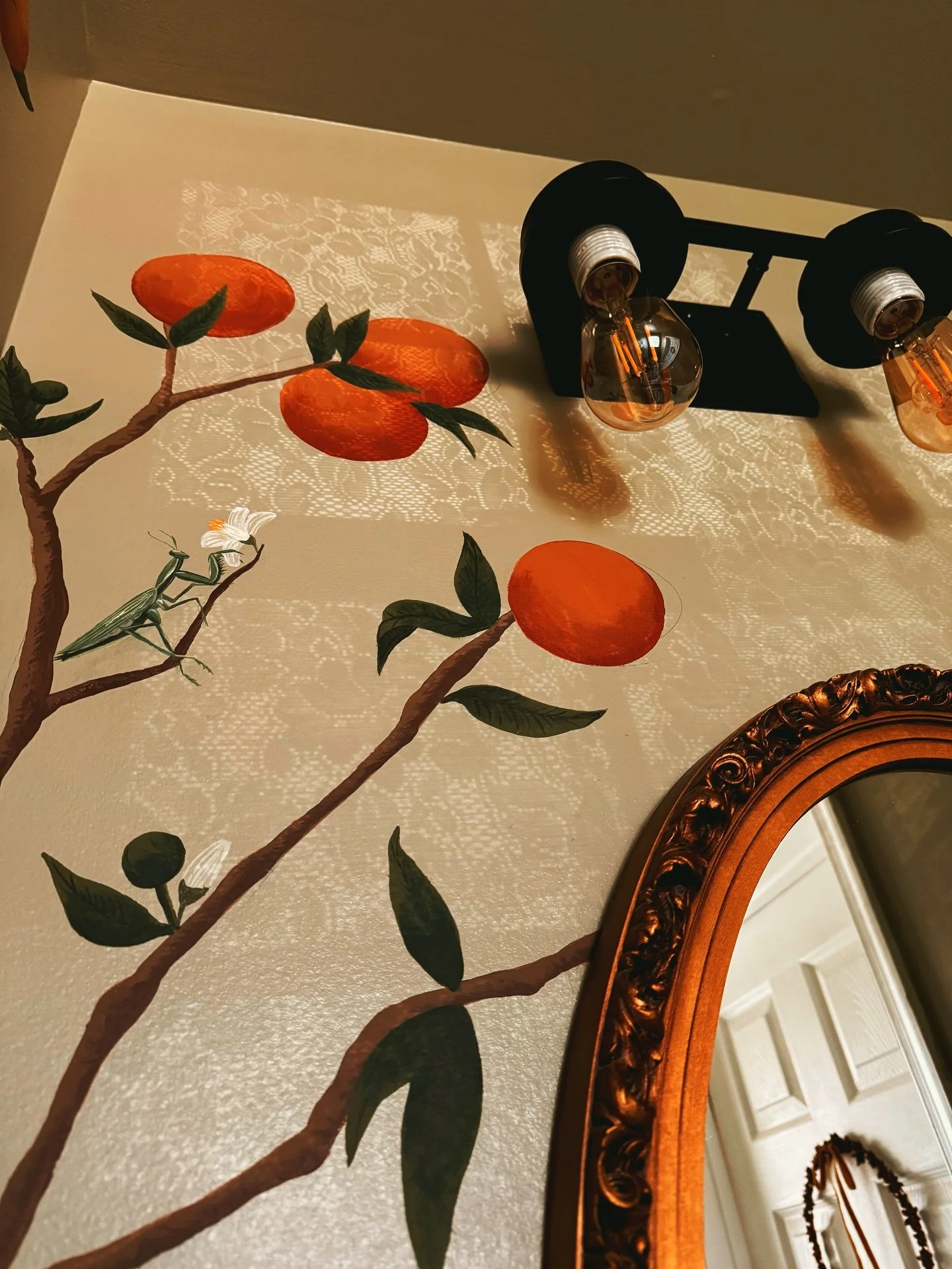 Finished orange tree mural details photos 🍊🫶🍃🪲👐

10/10, WOULD recommend painting a frog to stare at you while you pee. 🐸I love the whole vibe of this bathroom that @fair.freckled.friend styled. We had so much fun thinking of the cutest little c