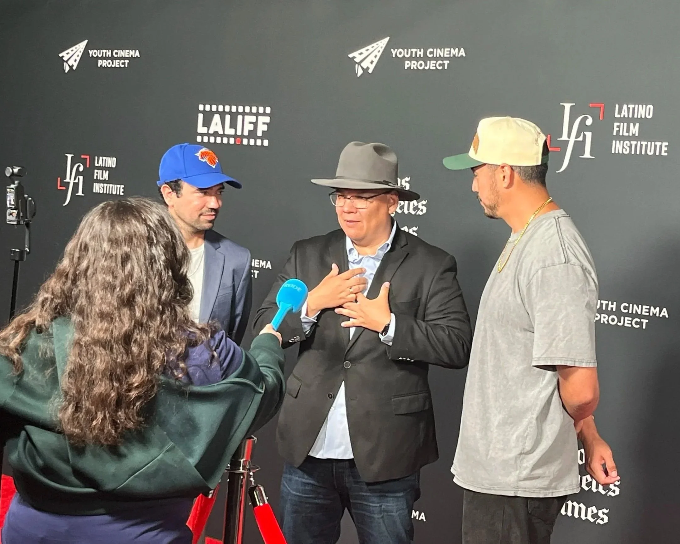 Creator Erik Martinez and Director Kahlil Maskati with Actor Julio Macias being interviewed at LALIFF.