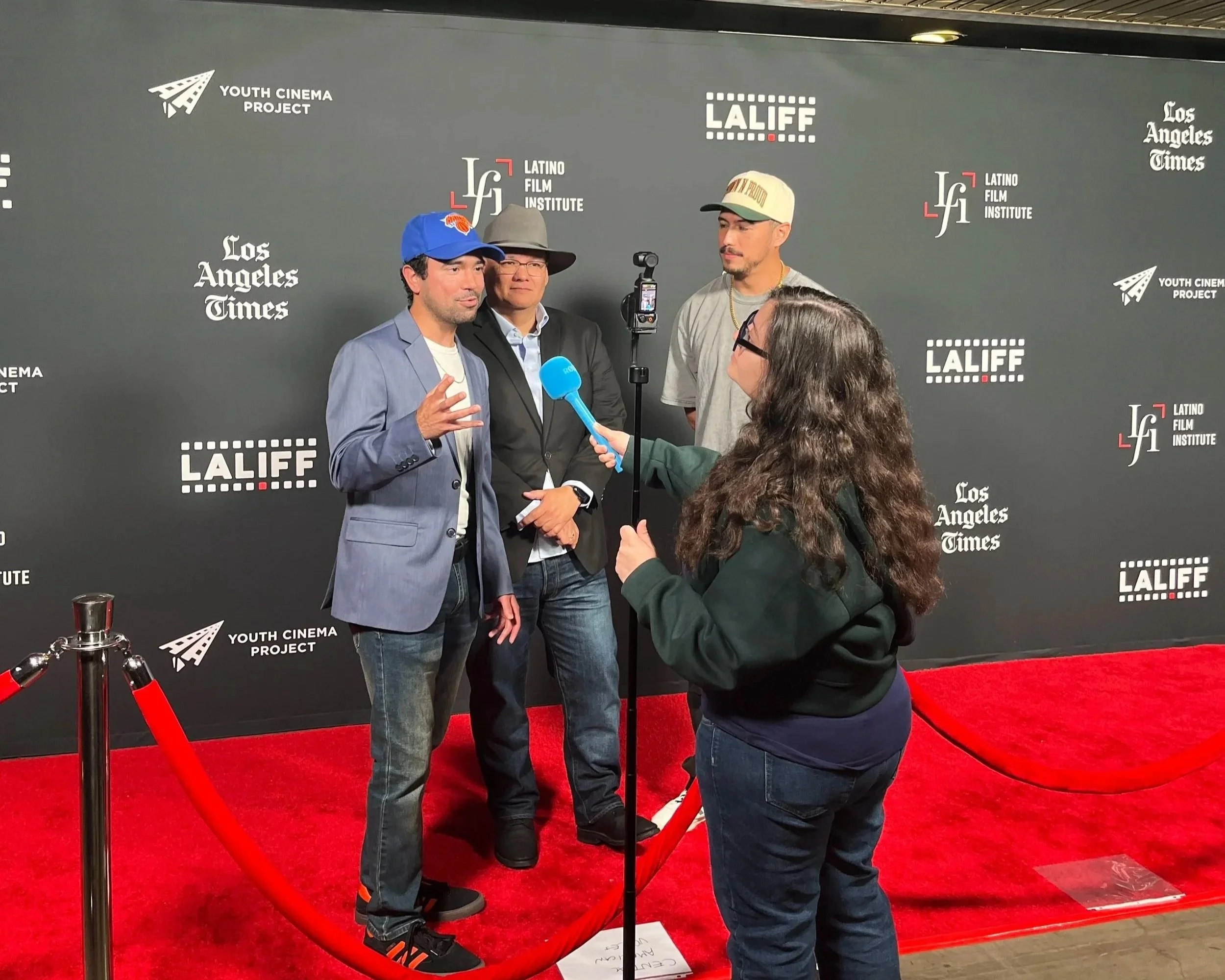 Creator Erik Martinez and Director Kahlil Maskati with Actor Julio Macias being interviewed at LALIFF.