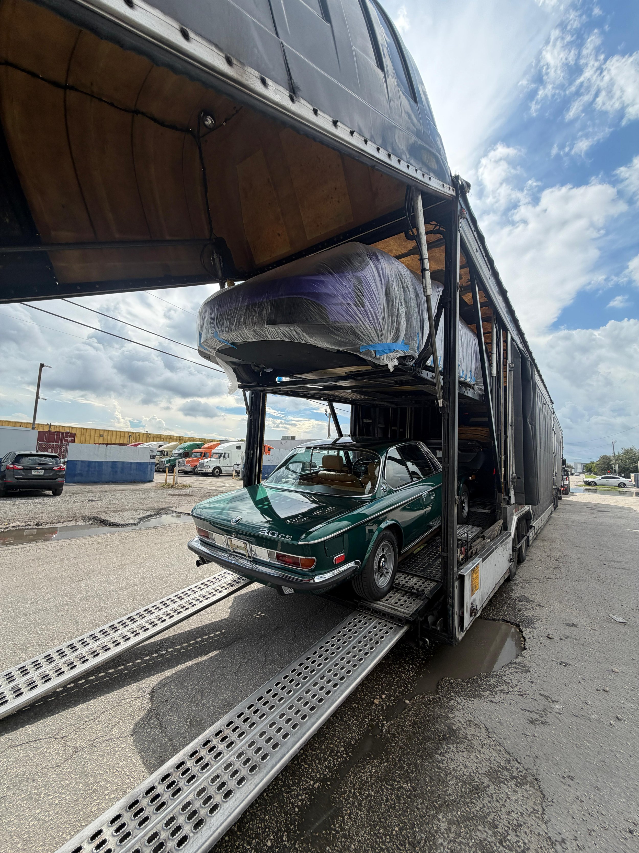 Classic car shipping services from Miami with secure international transport for vintage and luxury vehicles. Vintage classic car ready for international shipping from Miami port to Caribbean destinations Classic car secured inside container for safe