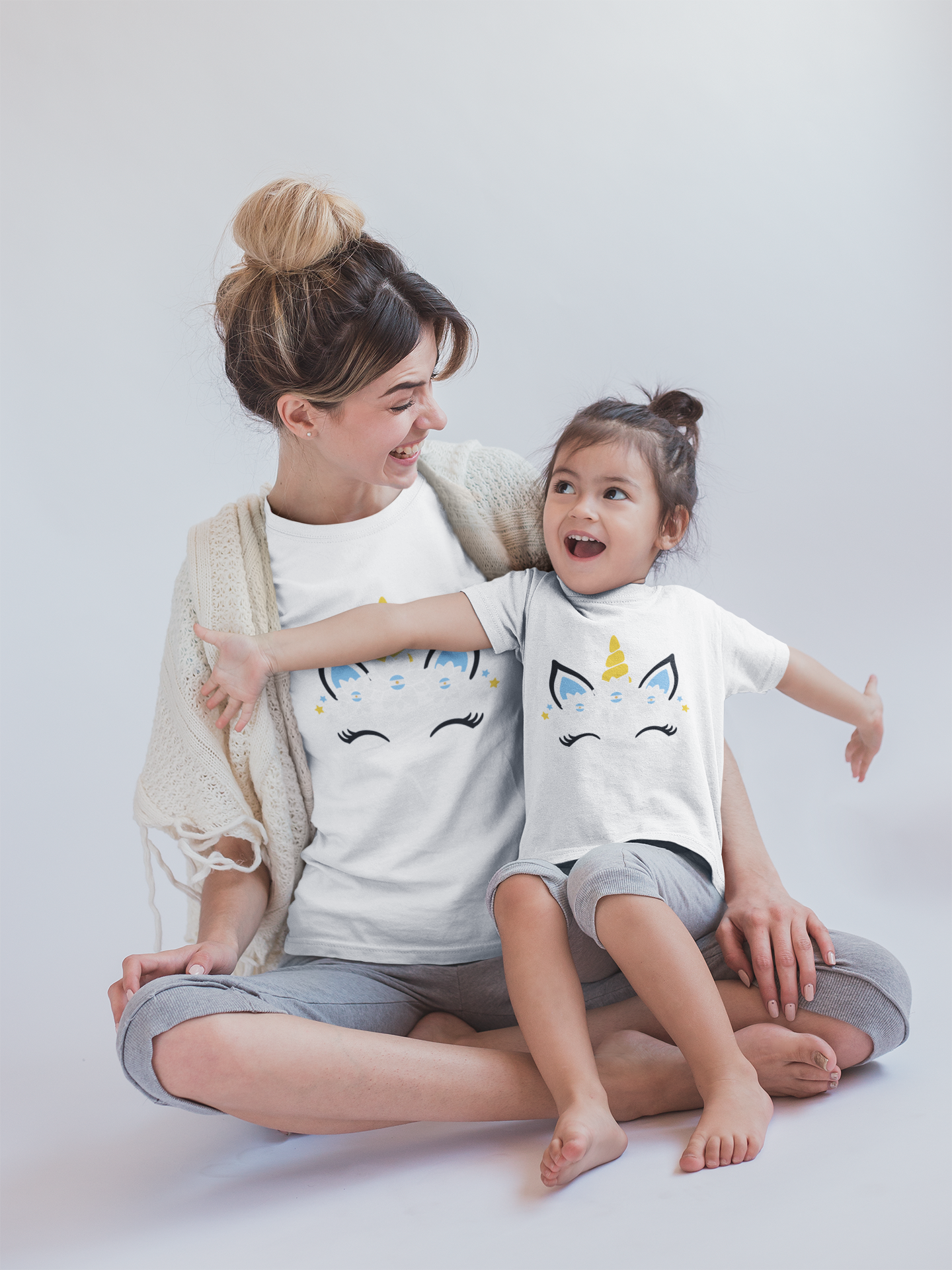 girl-and-mom-having-fun-wearing-t-shirts-mockup-in-a-white-room-a20274.png