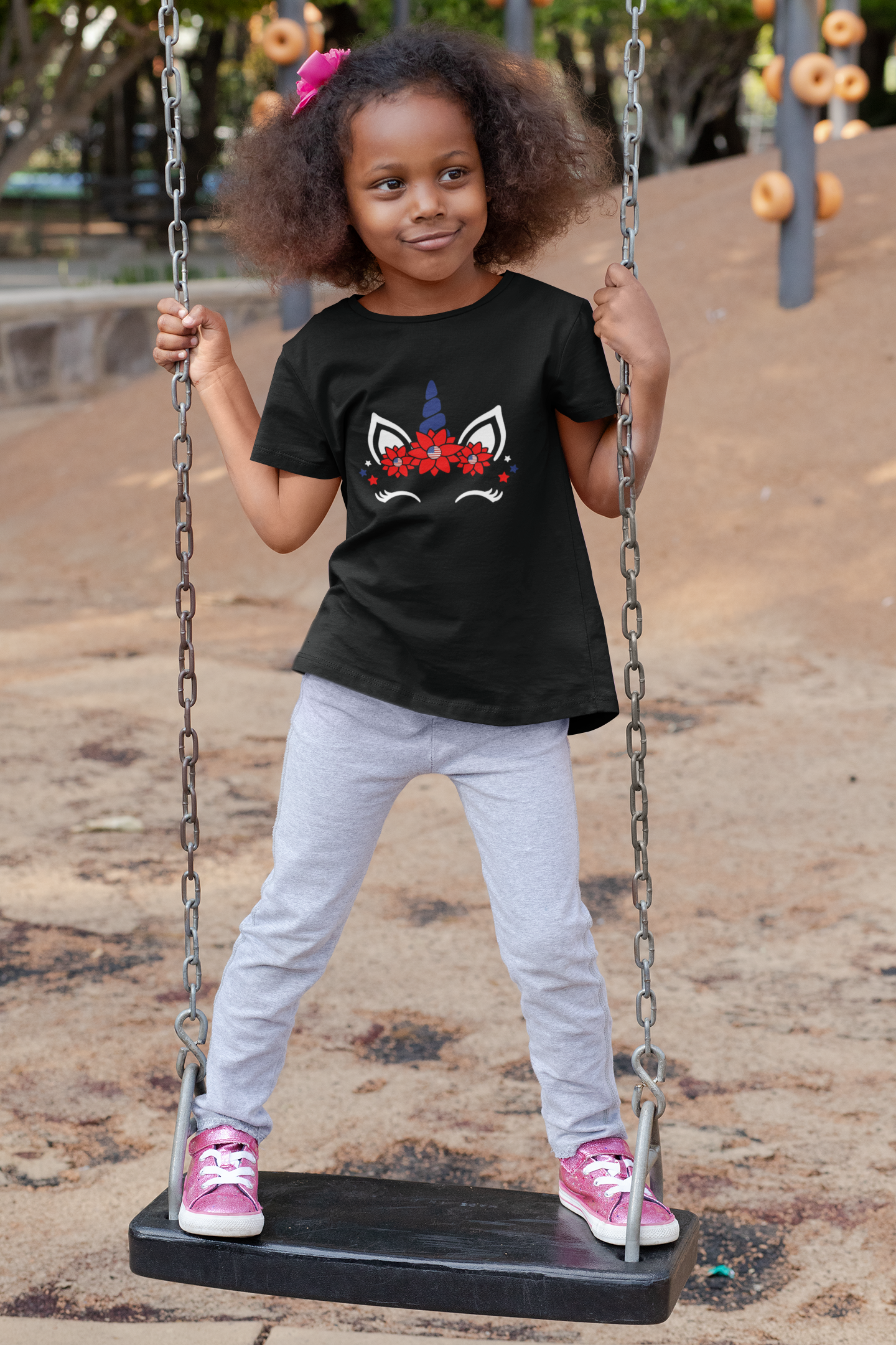 t-shirt-mockup-of-a-playful-girl-standing-on-a-swing-32179.png