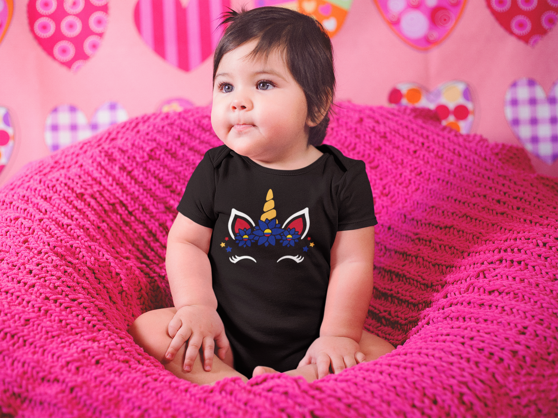 beautiful-little-baby-girl-sitting-on-a-pink-sofa-while-wearing-a-onesie-a14047--2 (1).png