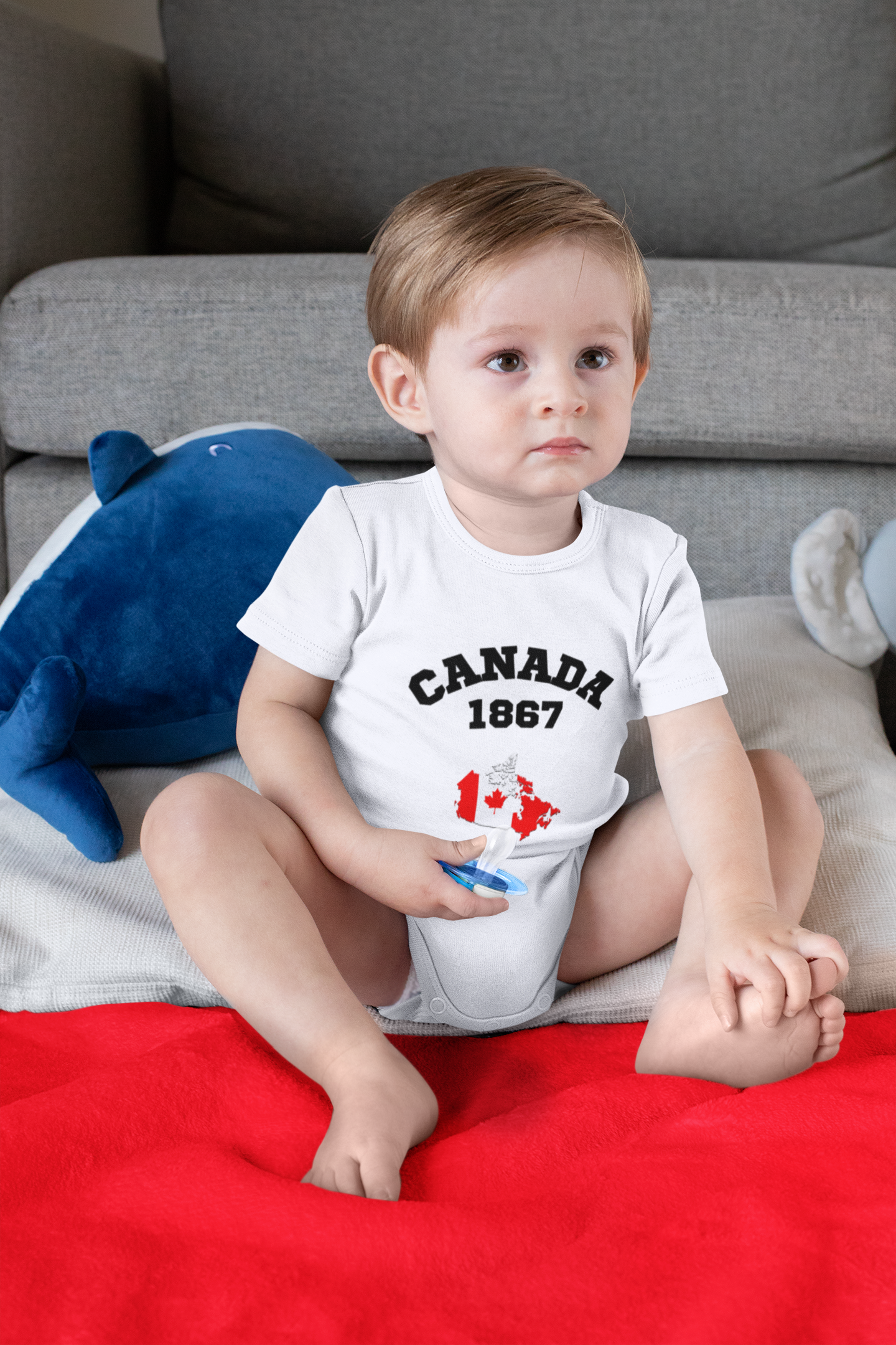 onesie-mockup-of-a-boy-sitting-on-a-sublimated-blanket-30015 (1).png