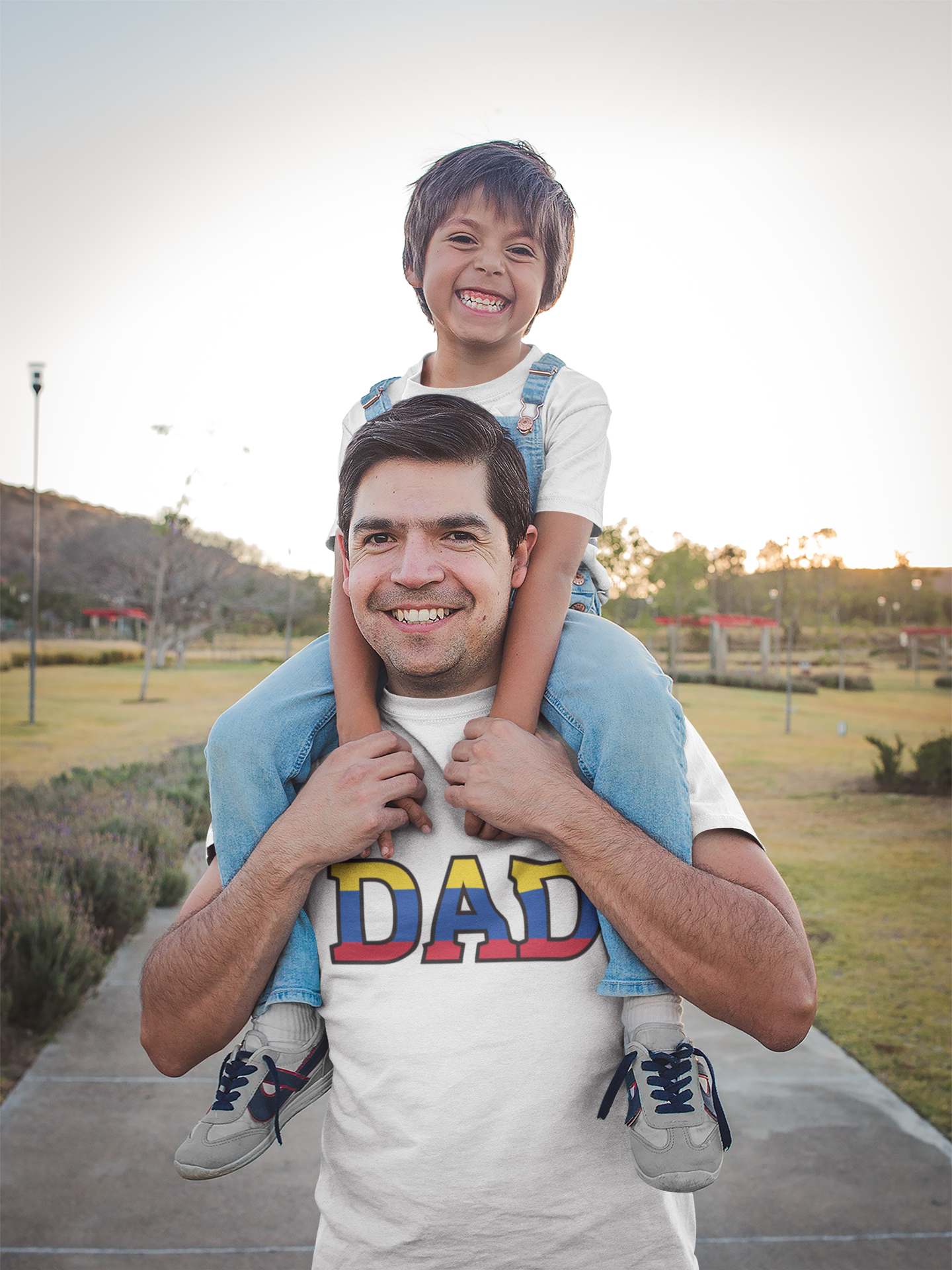 smiling-dad-wearing-a-t-shirt-mockup-walking-with-his-son-a20194.png