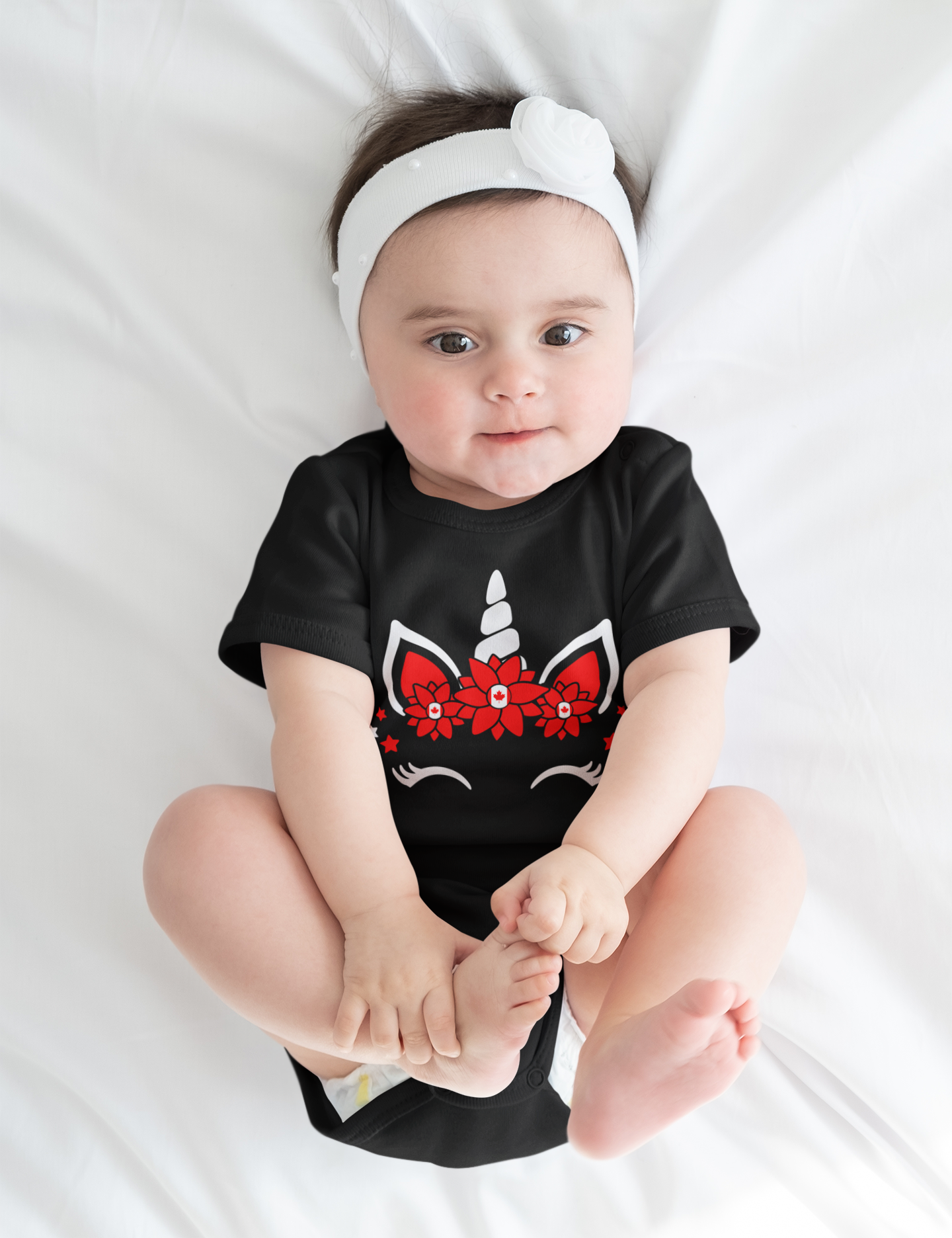 onesie-mockup-featuring-a-baby-girl-lying-on-a-white-bed-m6223-r-el2.png