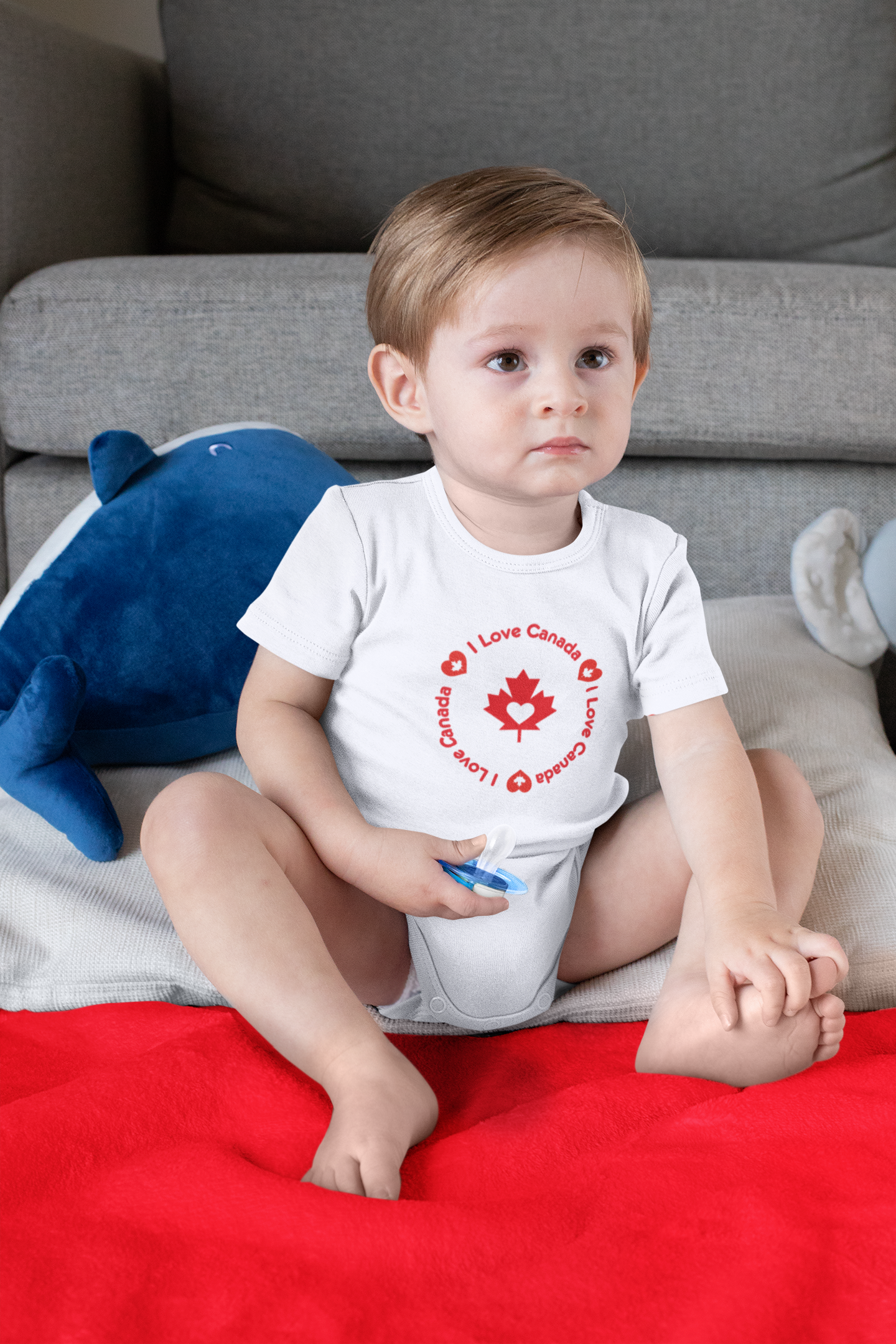 onesie-mockup-of-a-boy-sitting-on-a-sublimated-blanket-30015 (1).png