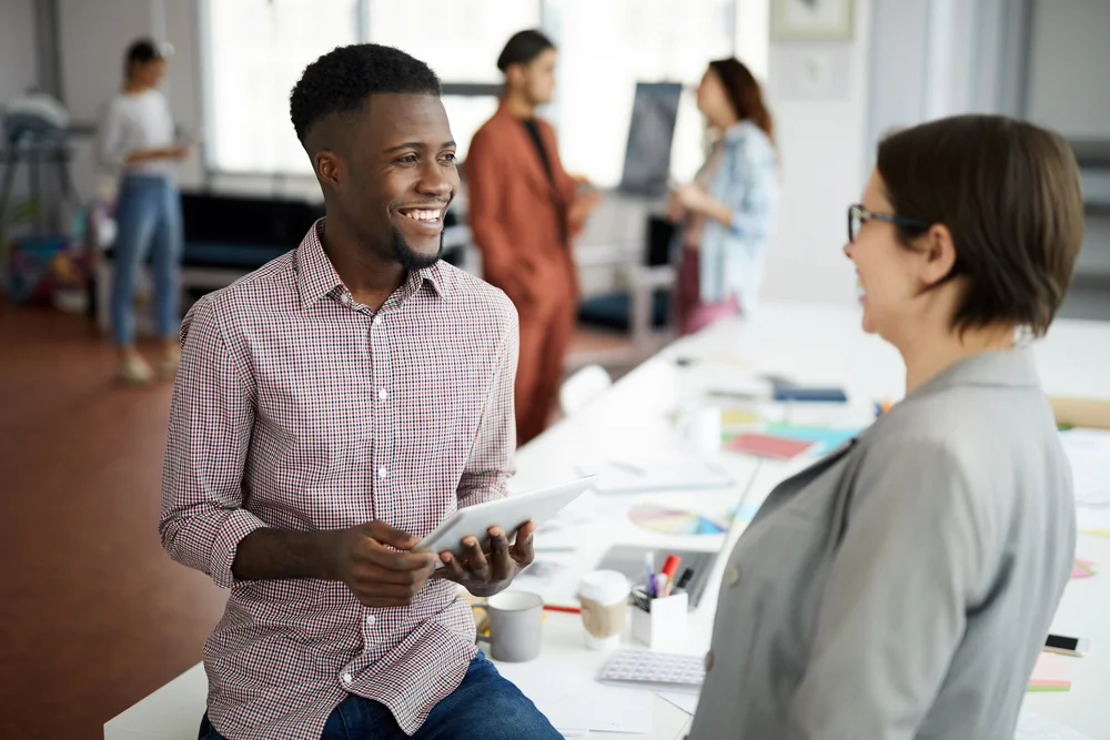 Two colleagues having a conscious workplace conversation