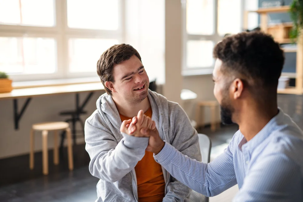 Two people connecting in an inclusive workplace setting