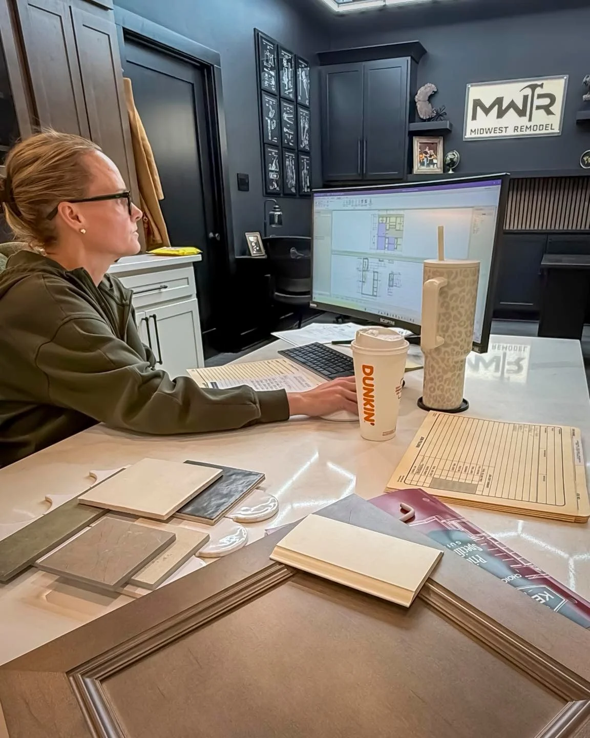 What does a design-build desk look like?

It looks like cabinetry elevations on one screen.
Floor plans under review.
Material samples layered across the table.
Specs, schedules, and more than one decision happening at once.

Before a kitchen feels e