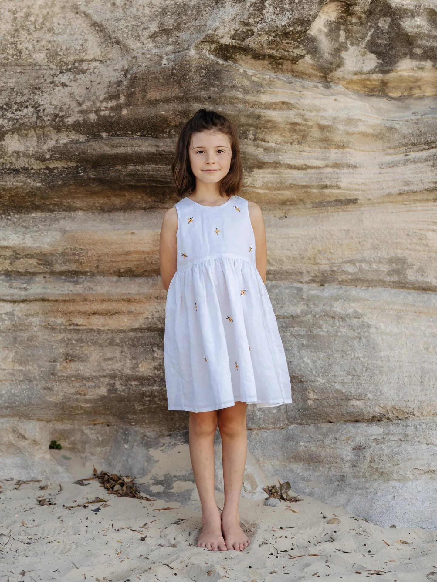 ANNA BEE SIGNATURE DRESS  This was our first Anna Bee creation. Hand embroidered bees make each dress unique. We are passionate about the creatures in our gardens. Anna Bee supports the Wheen Bee foundation. The Wheen Bee Foundation is committed to r