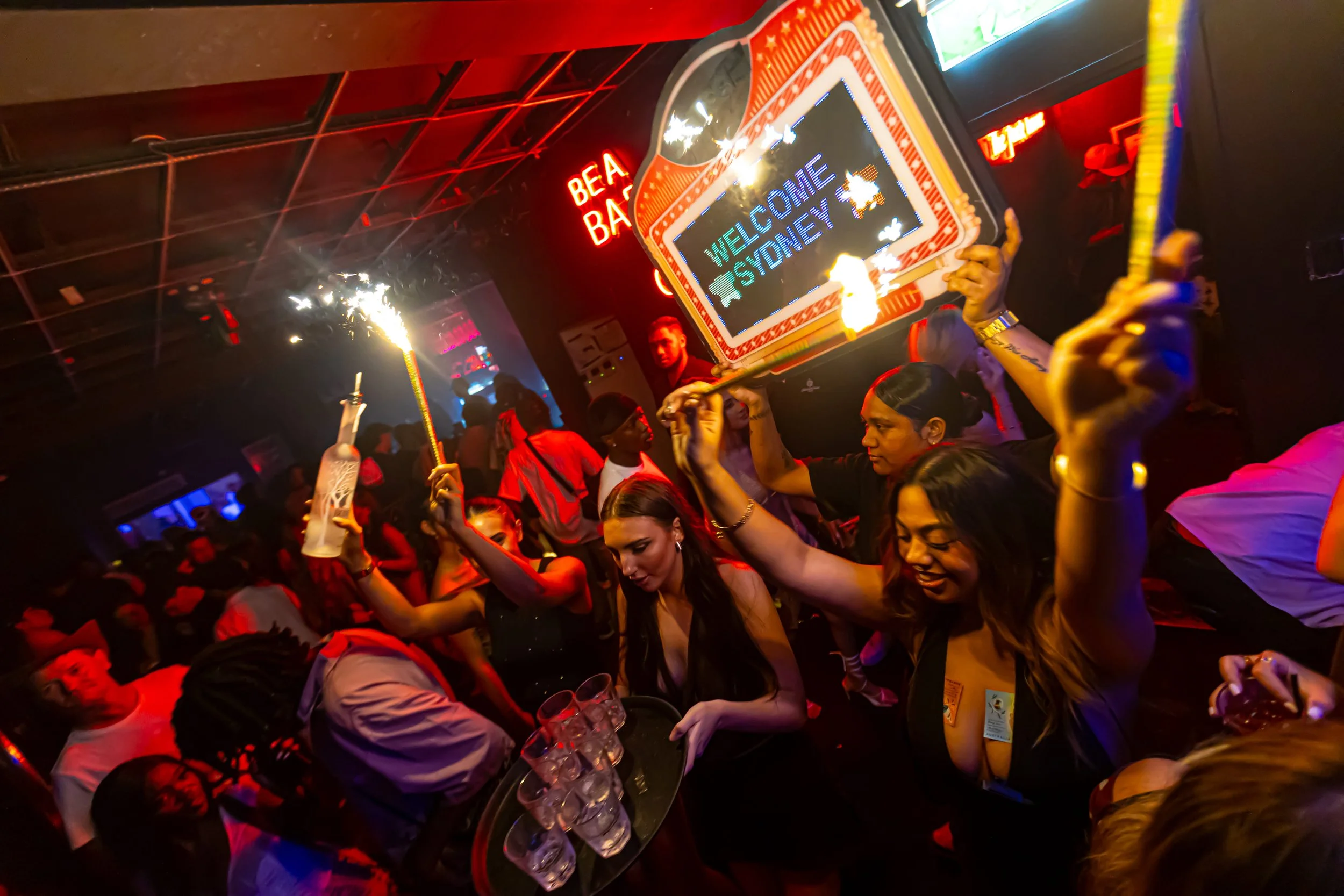 su casa brisbane rooftop showing sign, sparkles and bottles in nightclub