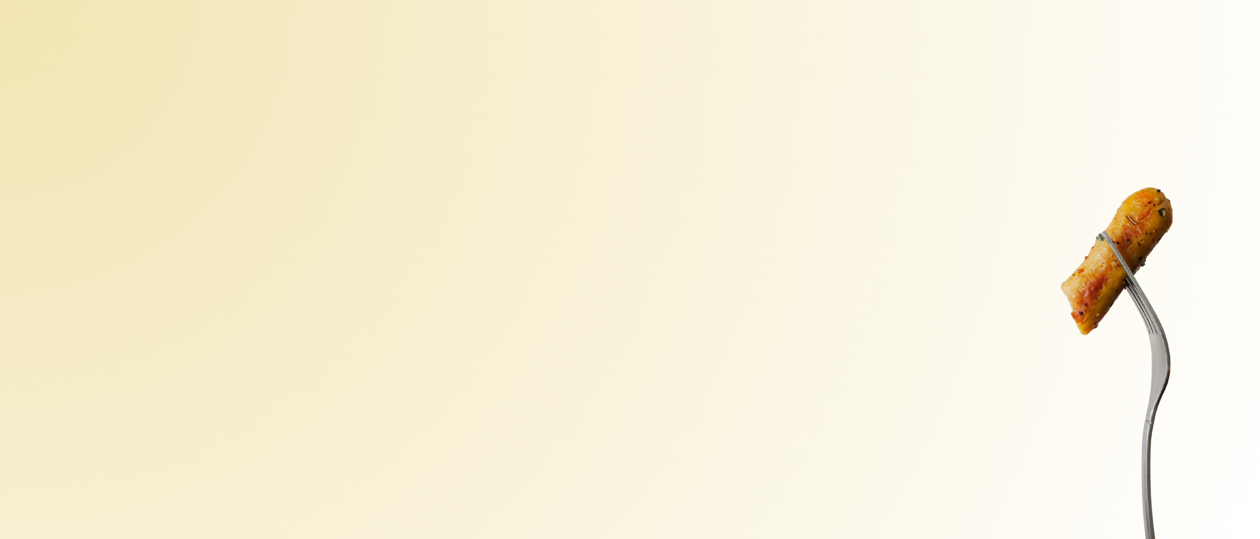 A fork holding a piece of sausage against a light gradient background.