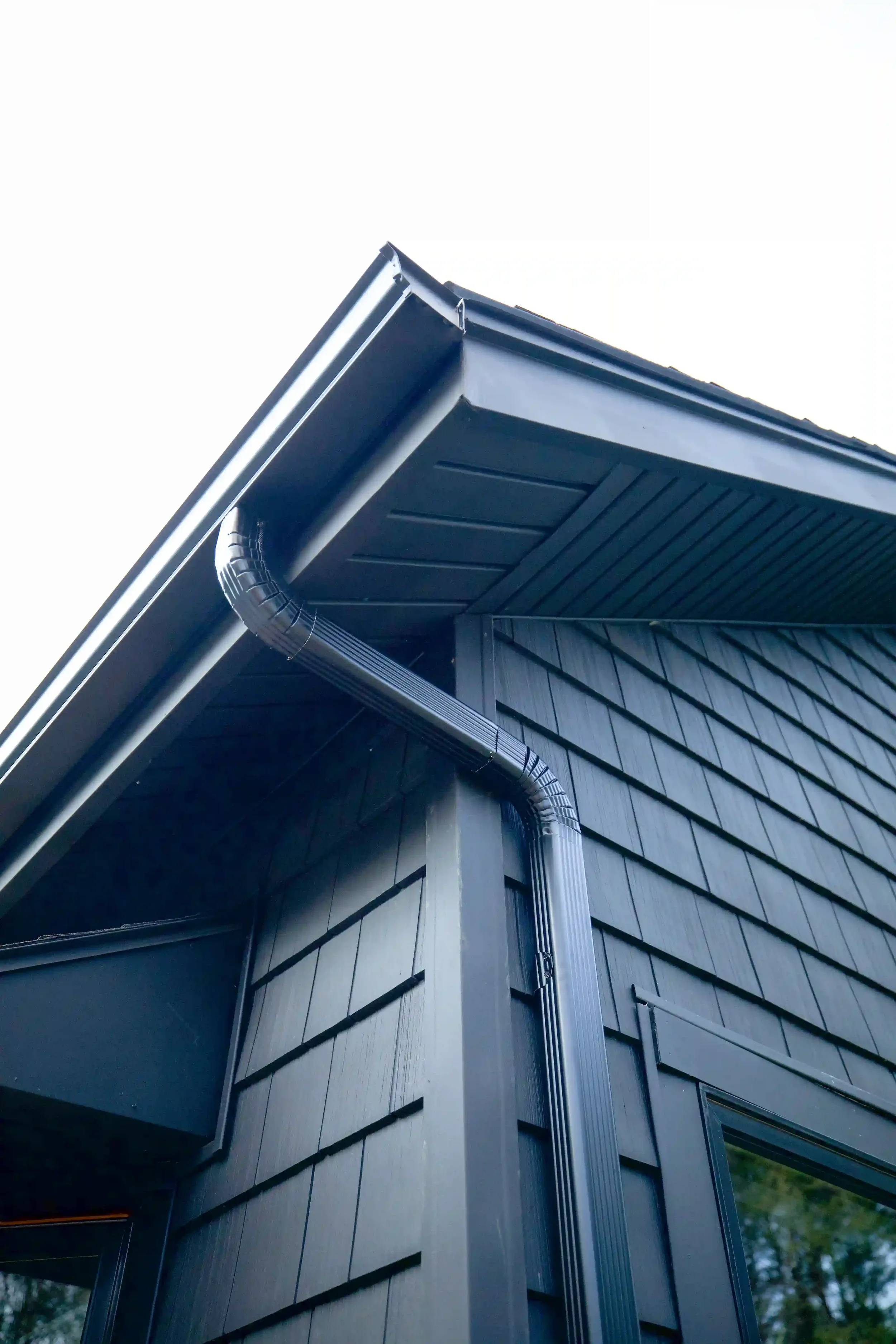 damaged gutter downspout causing drainage issues before repair in Northampton MA