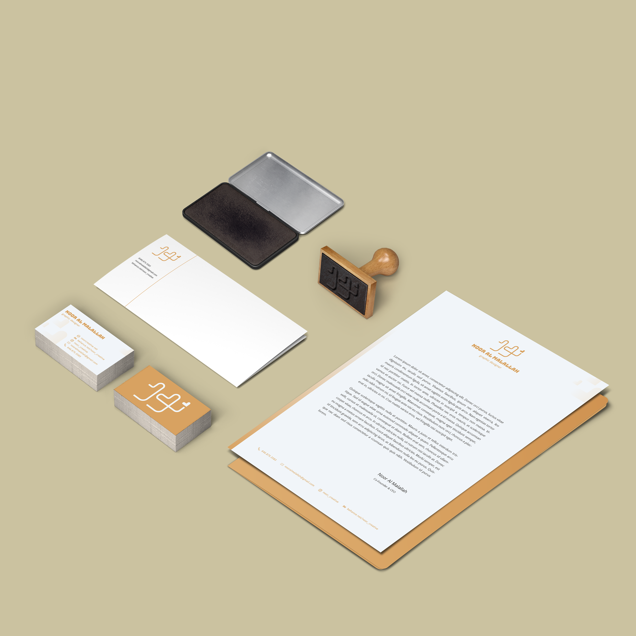 Business stationery set including letterhead, business cards, envelope, stamp, and ink pad on a beige background.