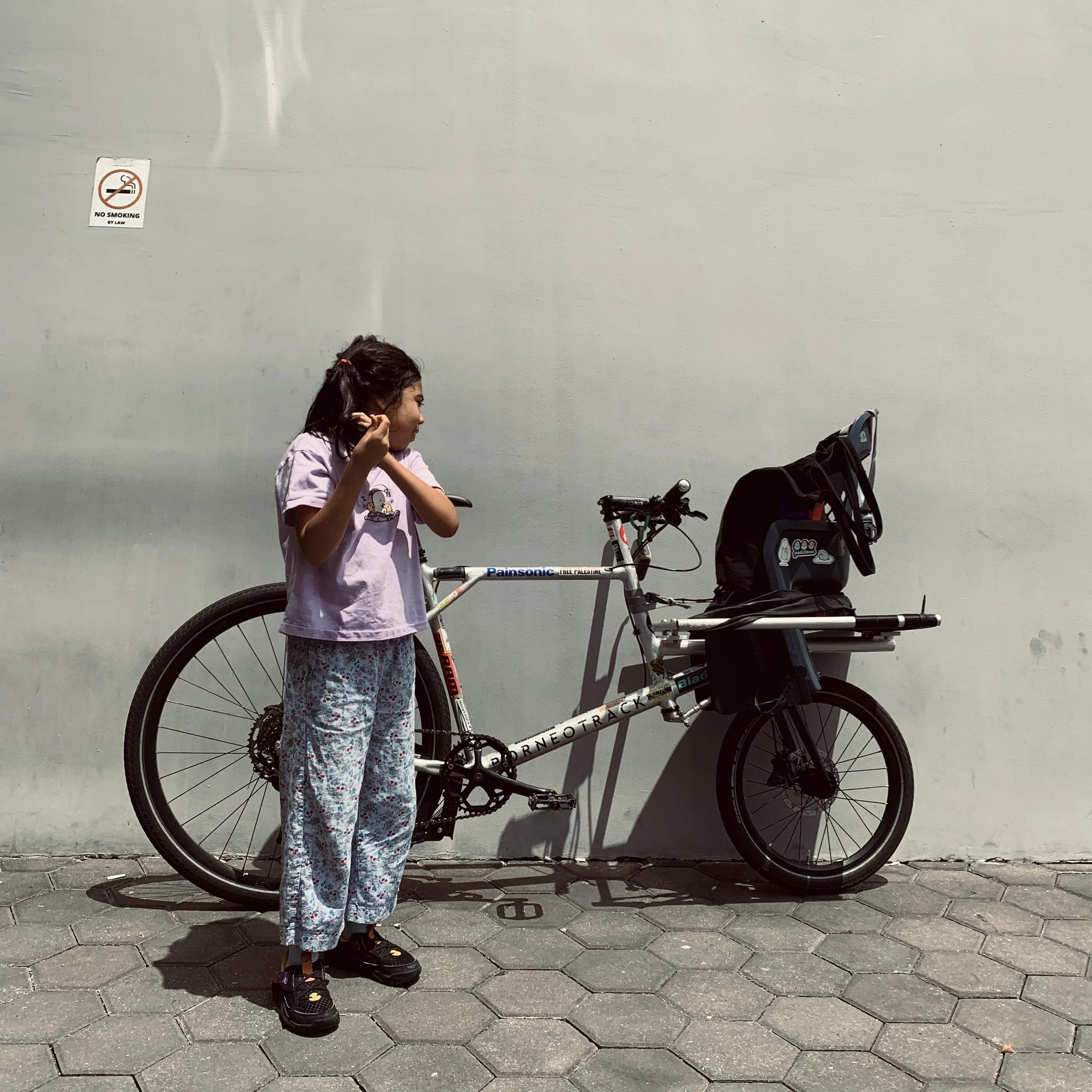 Bicycling with Inaya on a cargo bike. Image courtesy of artist.
