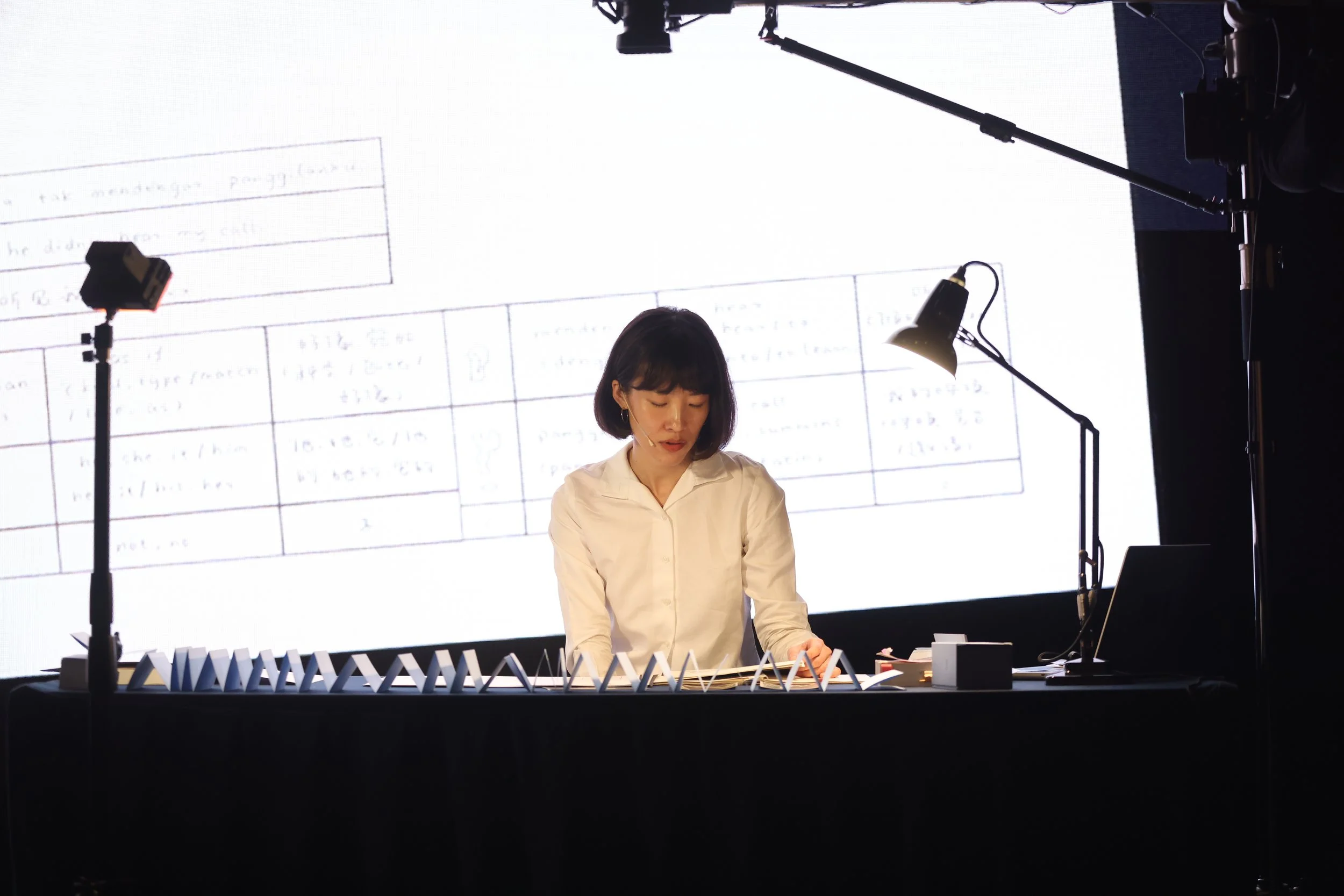 Performance still of Chang Yuchen, Coral Dictionary (a lecture), 2025. Image courtesy of Tanoto Art Foundation.