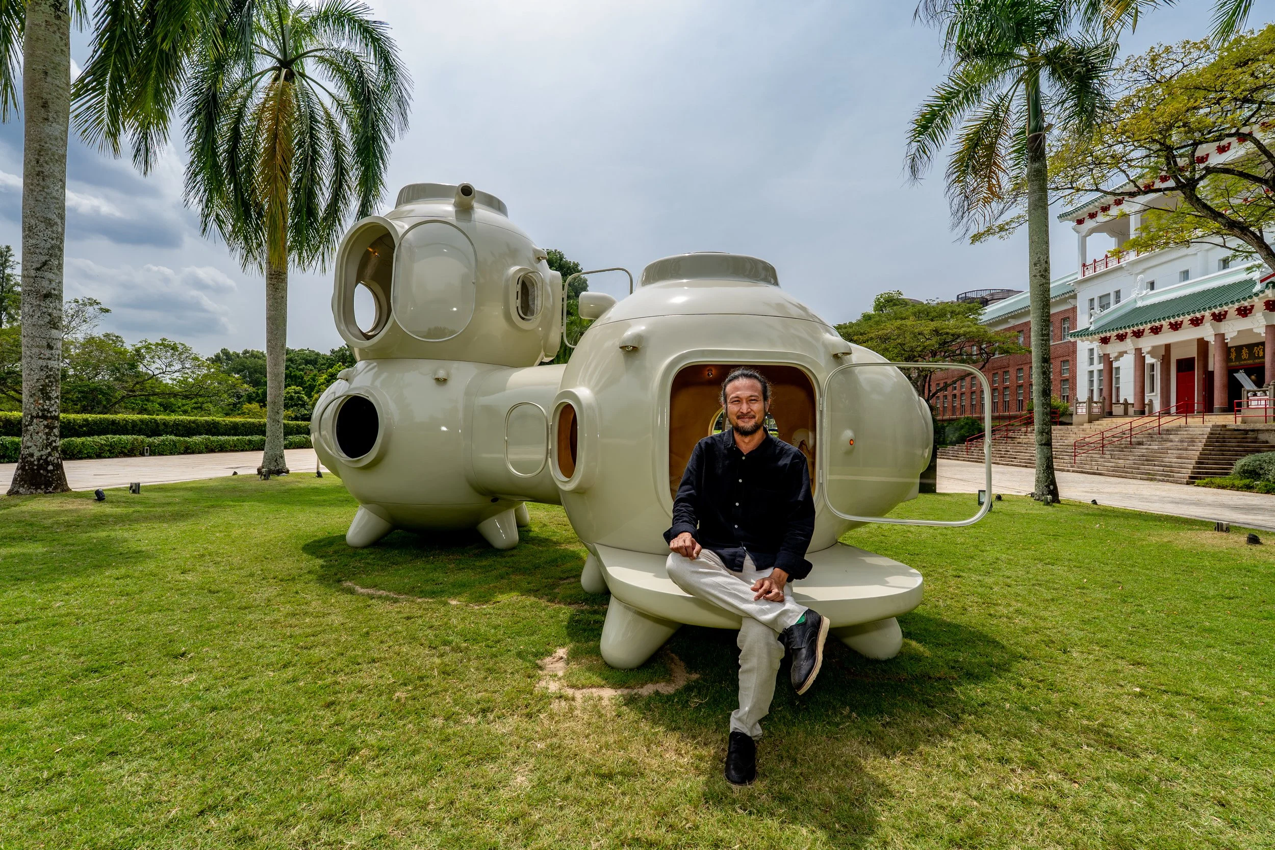 Torlarp Larpjaroensook with his work Cosmos of Nostalgia (2025). Photo by Third Street Studio. Image courtesy of NTU Museum.
