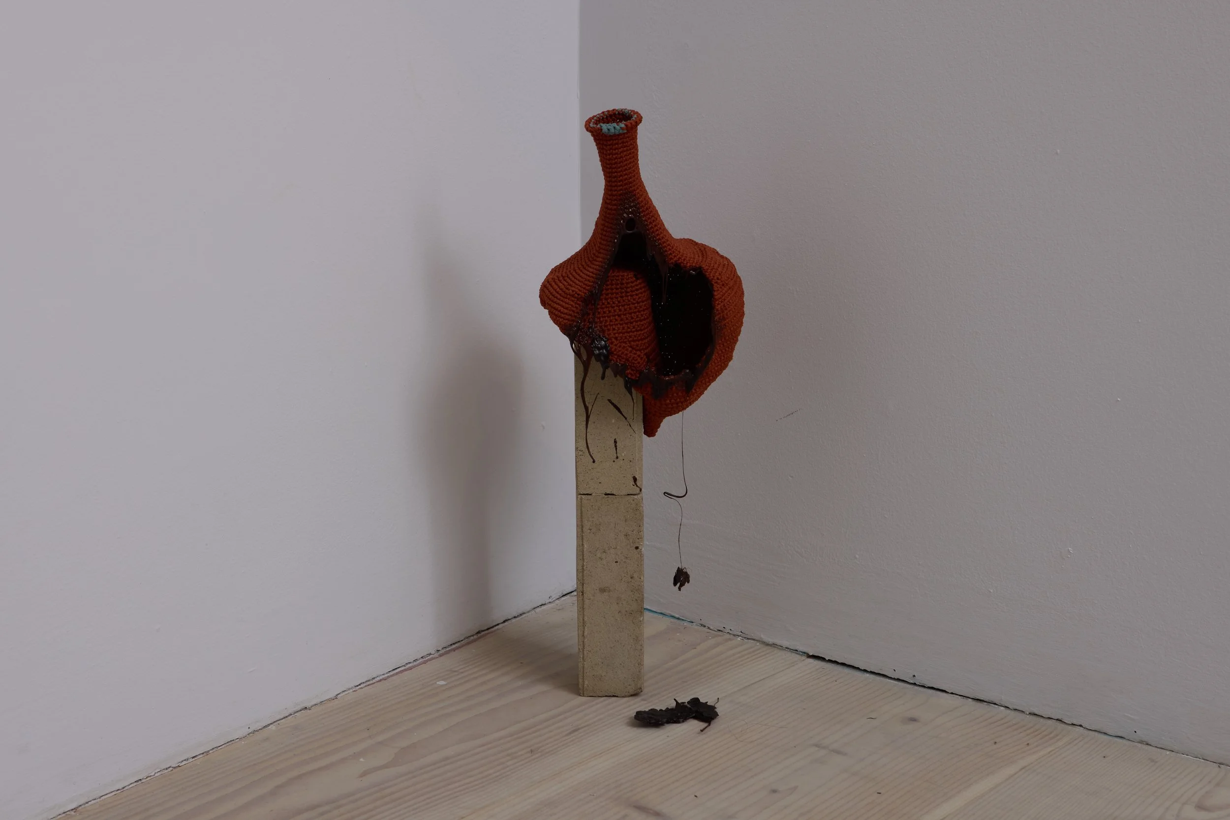Kelly Jin Mei, Untitled, 2026, crocheted and melted nylon, found brick. Image courtesy of Delfina Foundation. Photo by Tom Carter.