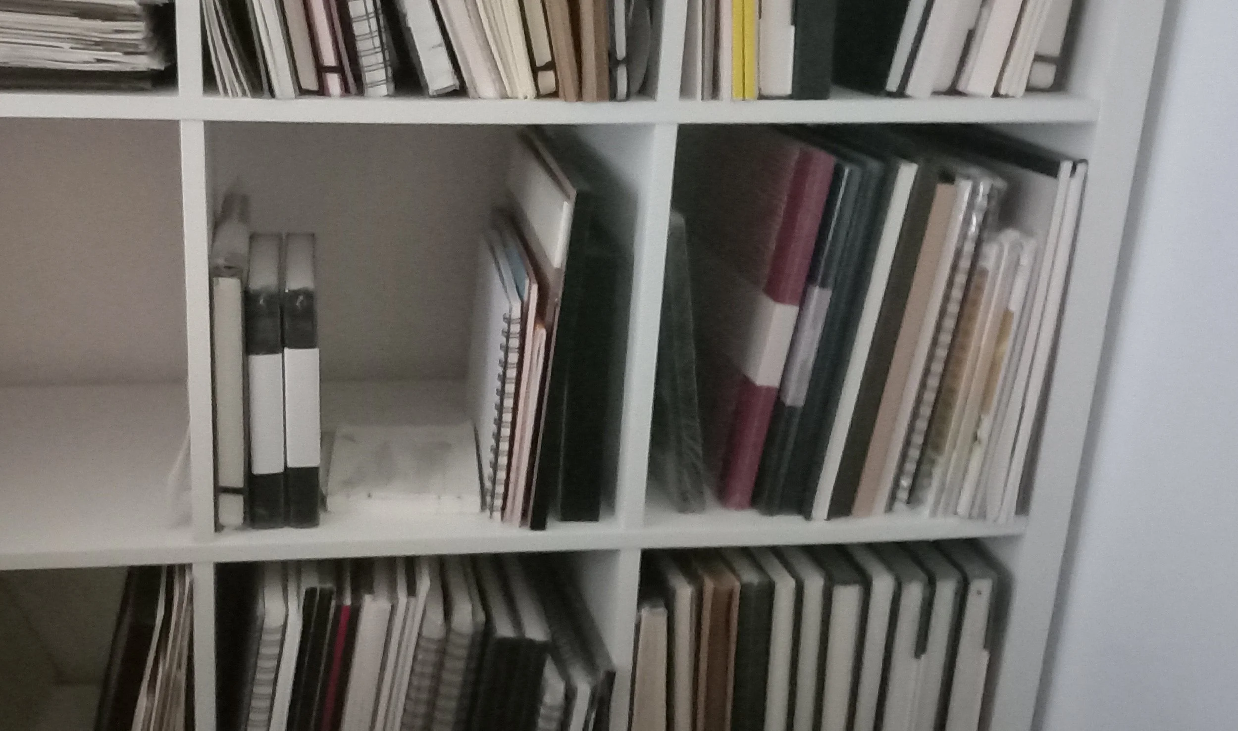 Sketchbooks on shelves
