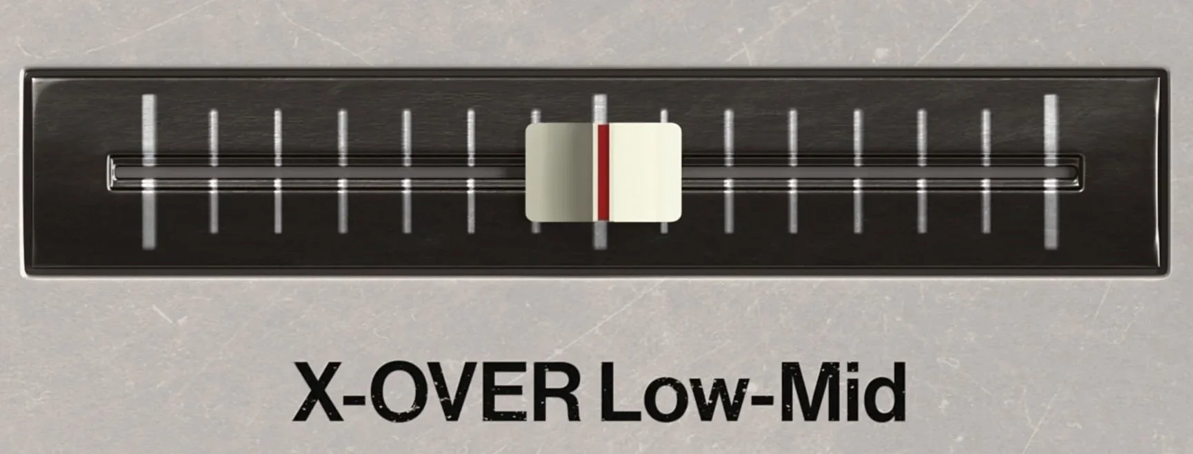 A close-up of a vintage control slider labeled "X-OVER Low-Mid" with a white knob and red indicator line, set at the middle position.