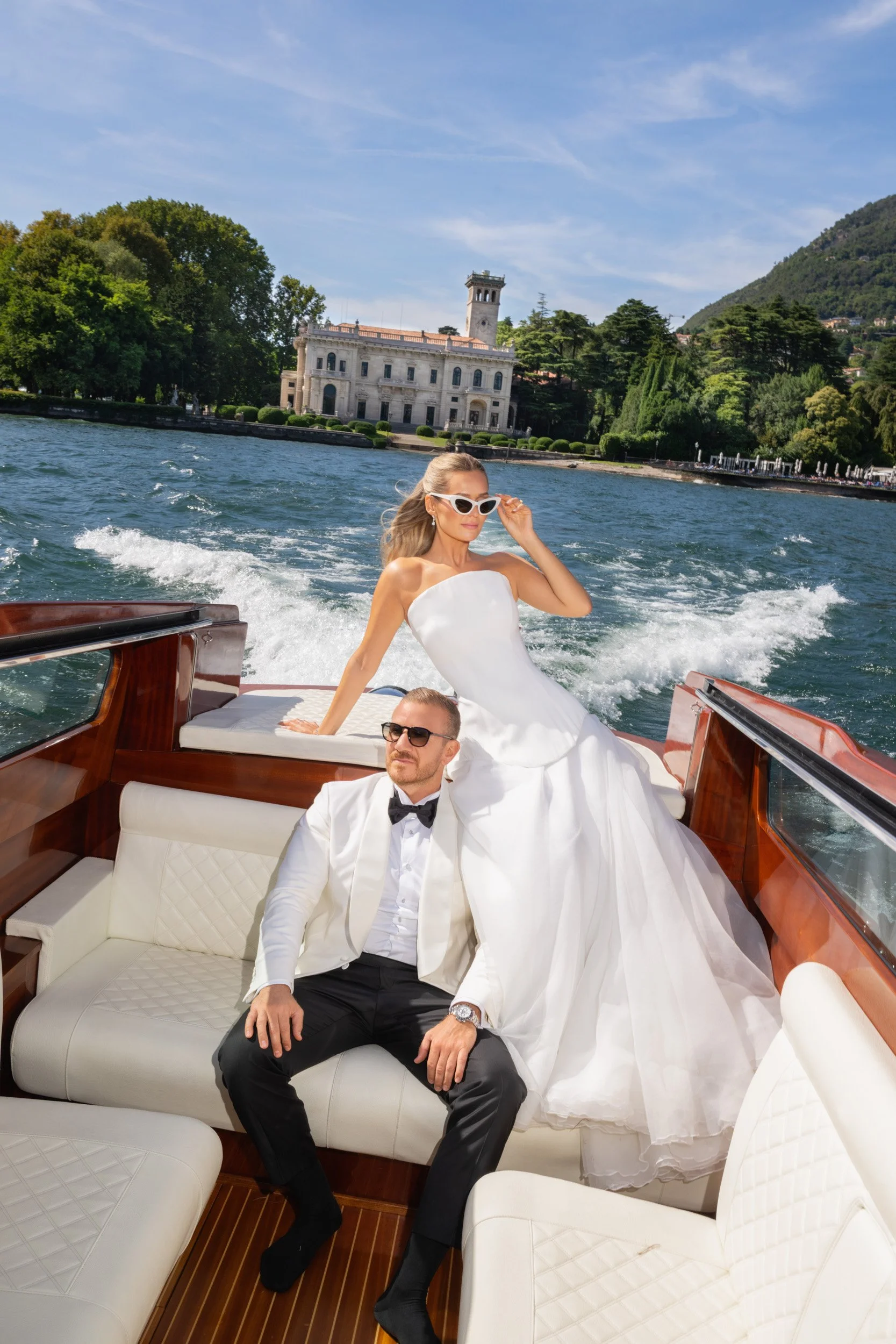 lake como boat shooting in front of villa erba, luxury wedding photographers italy