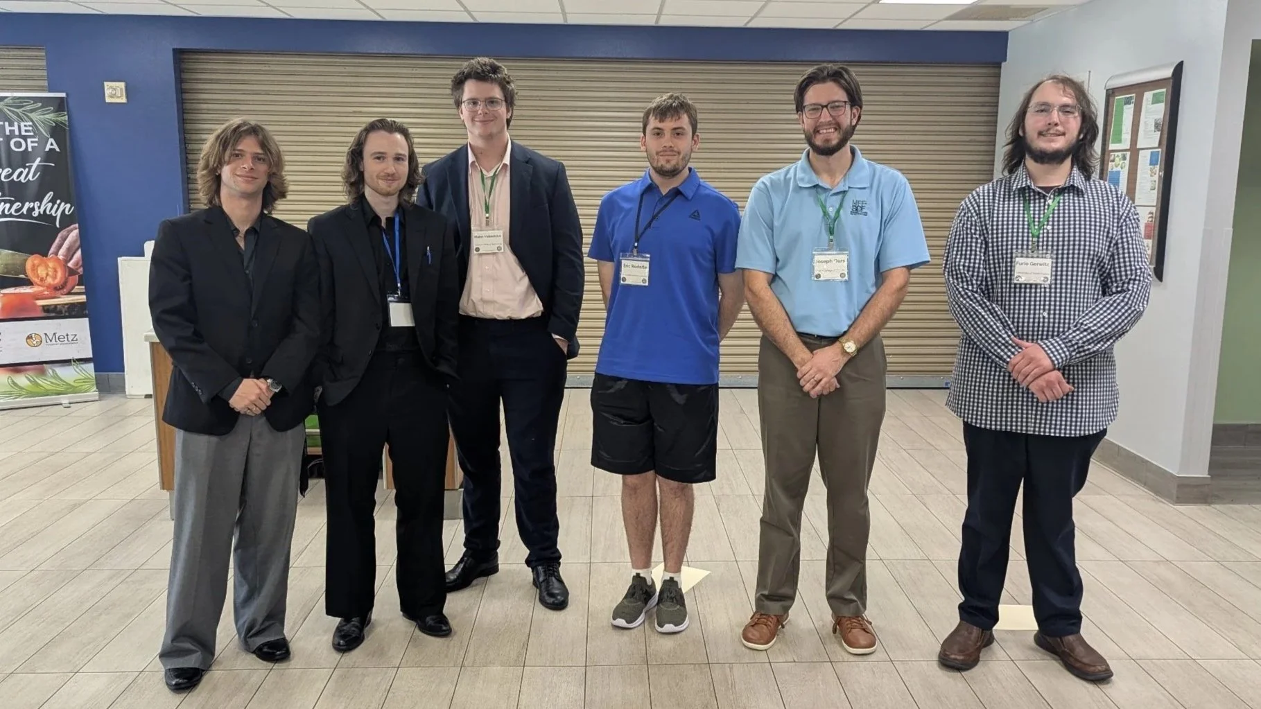 Undergraduate poster winners with Joe Ours chair of Student Awards Committee 