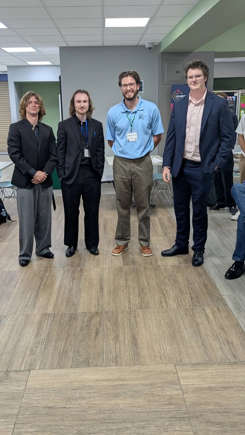 Anthonie Page, Matas Vaikevicius, and Scott Meeson were awarded best undergraduate poster with Joe Ours chair of Student Awards Committee 