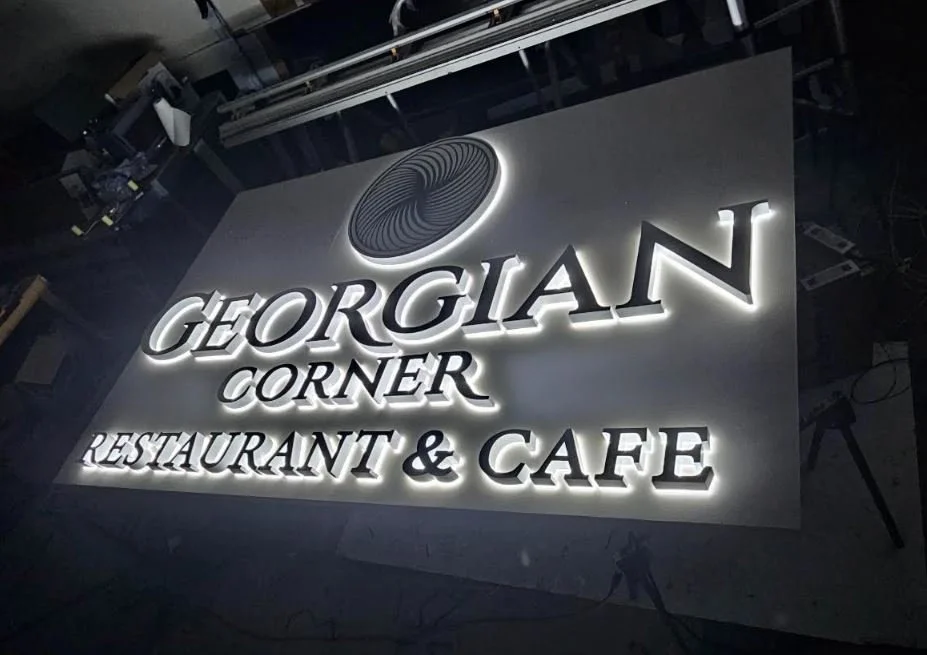 Scenic view of lake with mountains and cloudy sky